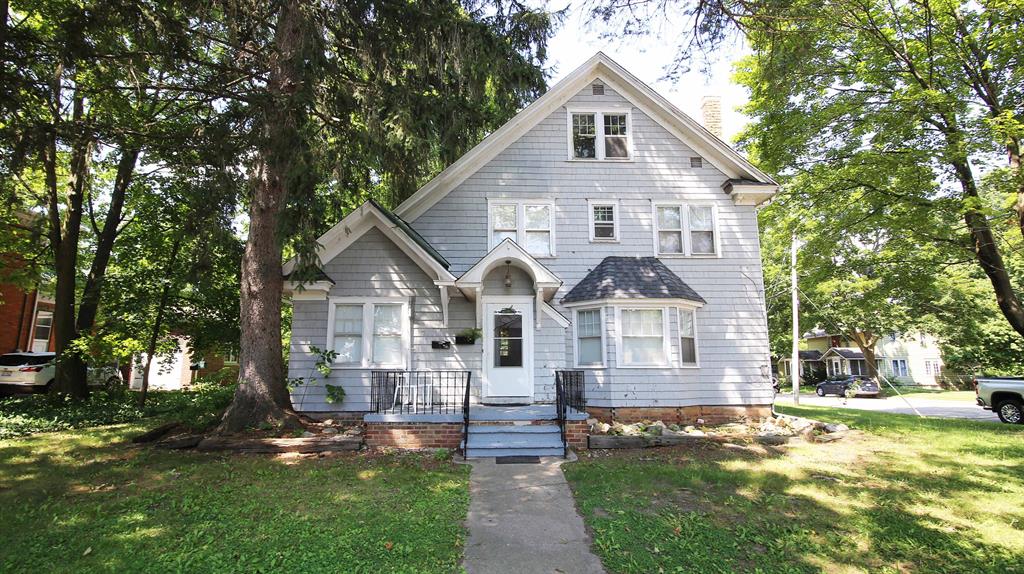 WELOME HOME! This charming Single Family Home (or duplex) in the heart of historic Bellevue is ready for a new owner! Whether you occupy the entire house, live in one unit or rent out both units....there are so many possibilities! This lovely corner lot offers ample parking, one carport and one garage space. This versatile floor plan is sure to please! From the moment you walk in the front entry area, you can access the main level unit or head upstairs to the second floor apartment. You can simply remove the doors in the entryway if you'd like to open up the entire home to occupy. Both units offer entrances from the front or back of the property. The main level features 1-2 bedrooms, a spacious living room w/fireplace, a roomy kitchen, an enclosed back porch and access to the basement!The upstairs offers 3 good sized bedrooms, a large living room w/ fireplace, a bright & airy kitchen and an enclosed back porch. Most of the upstairs also has wood floors! Both floors have their own washer/dryer and ample storage space throughout. With a new roof in 2019, it should be maintenance free for years to come. Don't miss your chance to own a piece of Bellevue's history! This quiet, close-knit community prides itself on it's heritage, with annual events, historic walking tours and a focus on preserving small-town charm! This home is conveniently located near schools, eateries, parks & more. Must see to appreciate! (The main front photo has a tree that's been digitally removed for a better view of the home, there is still a tree in the yard) Listing is also duplicated as a duplex.
