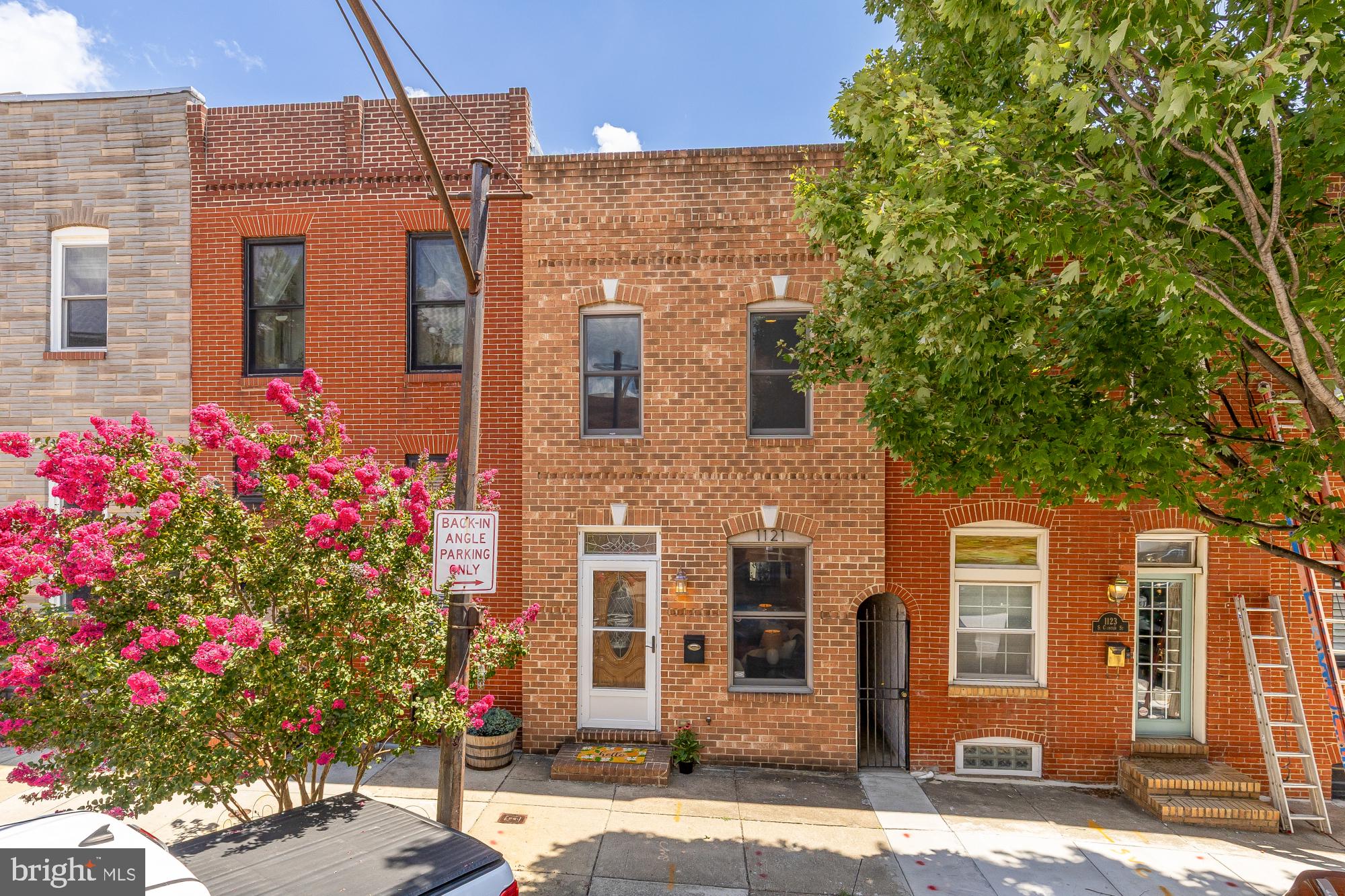 Just a few short blocks from the Canton Waterfront Park and O'Donnell Square, 1121 S. Clinton Street offers the best of city living in one of Baltimore's most sought-after neighborhoods. With 2,600 square feet of space with an attached garage, this is a rare opportunity to own a home with exceptional space and convenience. Enjoy easy access to neighborhood favorites, waterfront walks, Patterson Park, and some of Baltimore's best restaurants, shops, and cafés, all just moments from your front door.Inside, the open living and dining areas with hardwood floors flow into a spacious kitchen, with a charming nook that's perfect for a coffee bar or cocktail station. At the rear of the home, you'll find a half bath, a dedicated laundry room, and multiple storage closets that create the perfect mudroom entry from the garage.Upstairs are three generously sized bedrooms, including a spacious primary suite with a walk-in closet and an en-suite bath with a soaking tub and a separate shower. The unfinished basement offers abundant storage, while recent updates include a new water heater (July 2026), recoated roof (July 2026), fresh interior paint throughout (July 2026), and new carpet in every bedroom (July 2026).With 2,600 square feet, an attached garage, and an unbeatable Canton location, this is a rare opportunity you won't want to miss. Schedule your private showing today!