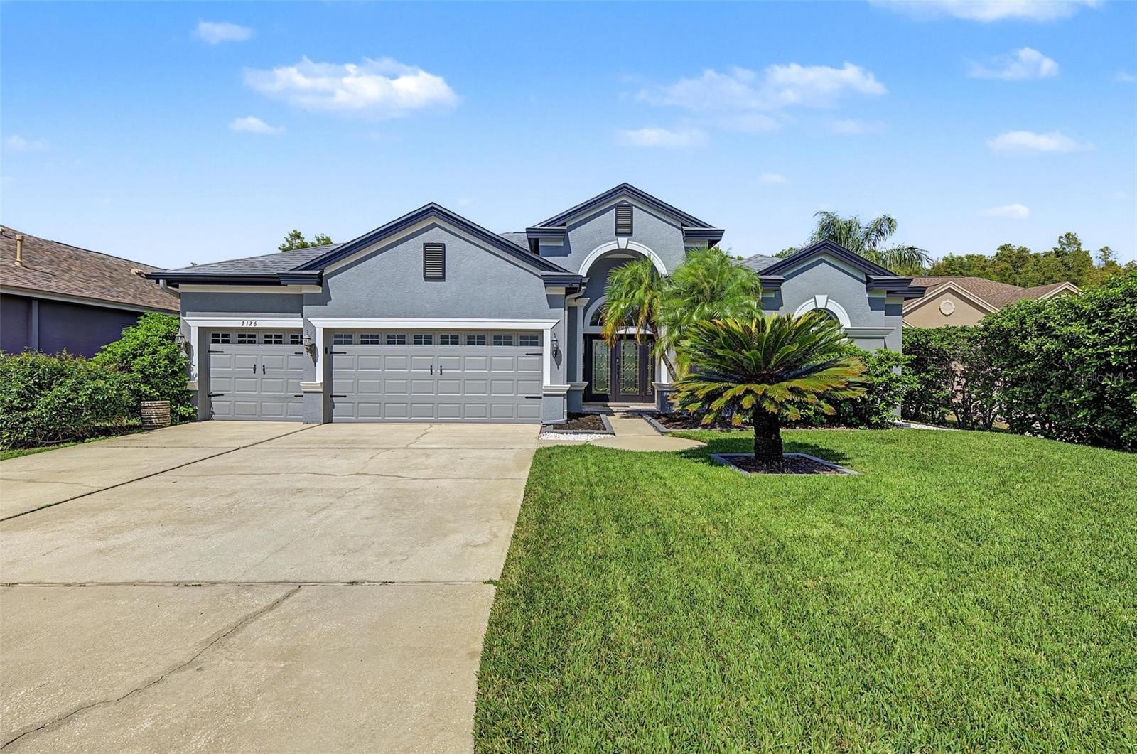 Under contract-accepting backup offers. Virtually Staged. IF YOU'VE BEEN LOOKING FOR FABULOUS, YOU HAVE FOUND IT! Welcome to this stunning SALTWATER POOL HOME on an INCREDIBLE PRIVATE LOT with an OVERSIZED DRIVEWAY. The SALT WATER POOL overlooks a lush treed area, NO REAR NEIGHBORS AND THE SCREENED LANAI HAS AN ADDITIONAL COVERED AREA. Invite your family and friends over because the pool is huge and the outdoor space is perfect for entertaining. Bring your grill, smoker and pool floats! The KITCHEN HAS BEEN THOUGHTFULLY UPDATED WITH HIGH QUALITY GRANITE, CABINETS AND APPLIANCES. There is room in the KITCHEN FOR A LARGE TABLE AND HAS LOTS OF ROOM FOR COUNTER BAR STOOLS. There is so much NATURAL LIGHT THROUGHOUT THIS AMAZING HOME, it's like a breath fo fresh air! If you have a king size bed, bookshelves, office area, the primary bedroom will fit your needs. Don't worry about being too close to each other in the bathroom because the PRIMARY BATHROOM IS HUGE! It features a SOAKING TUB AND A GORGEOUS WALK IN SHOWER AS WELL AS DOUBLE VANITIES. All of the bedrooms are ample size and feature ENGINEERED HARD WOOD FLOORS. ROOF REPLACED IN 2023 ALONG WITH HIGH QUALITY SOLAR PANELS. Get ready to save on that electric bill! The SOLAR PANELS HAVE BEEN PAID IN FULL! Trinity is gorgeous GATED COMMUNITY with a lovely parks and great for walks. Shoppig, medical facilites, resutants, spectacular beaches and Tampa International Airport are all a short drive away.