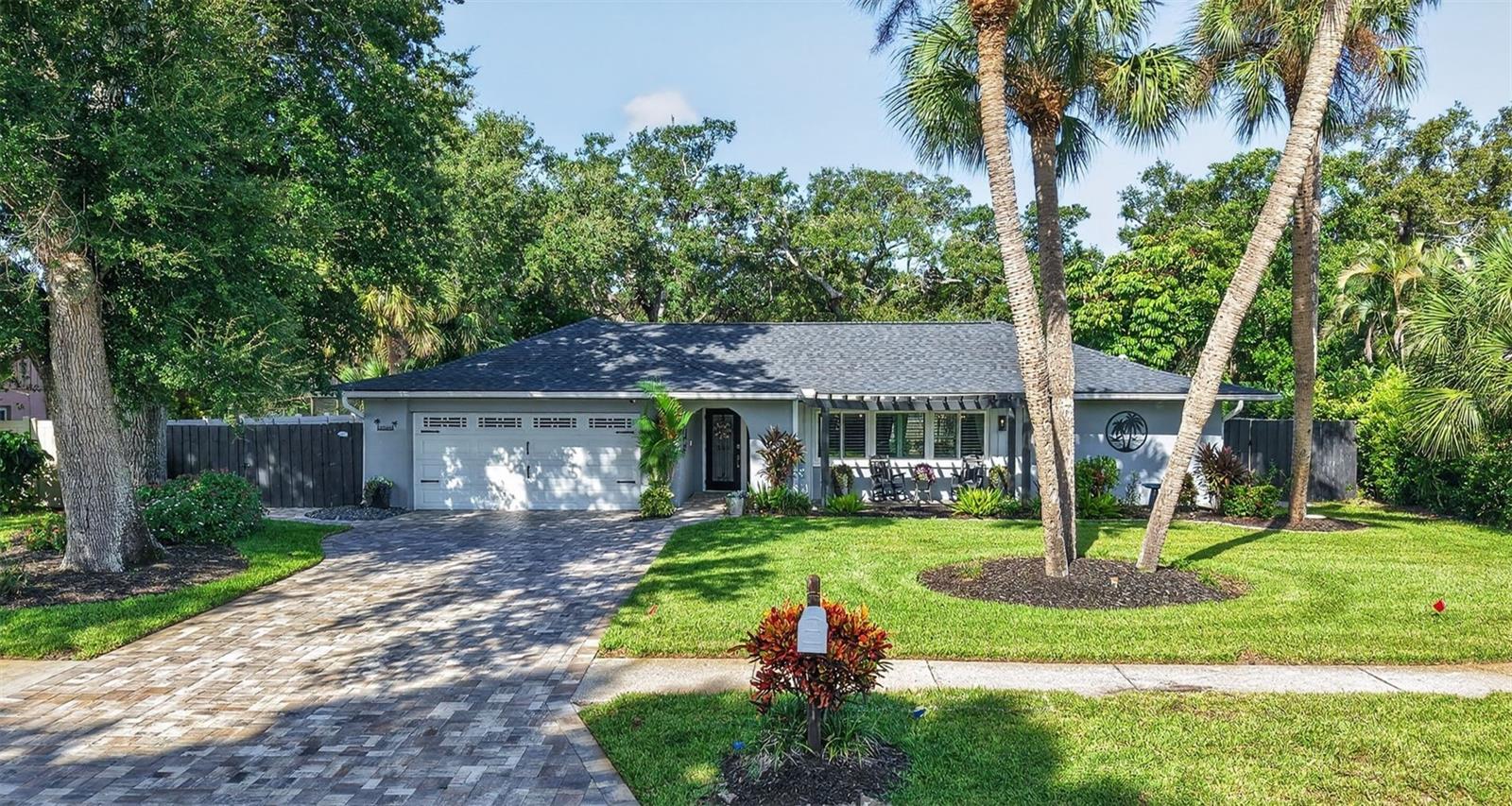 Under contract-accepting backup offers. Welcome to 10588 139th Way — where Florida living, thoughtful updates and an incredible outdoor lifestyle come together! Tucked away on a cul-de-sac in the desirable Century Oaks neighborhood, this beautifully maintained 3-bedroom, 2-bath pool home offers 1,841 square feet of living space on an oversized .26-acre lot, with the added peace of mind of major improvements already completed: NEW A/C 2025, ROOF 2022, ELECTRICAL 2021, HOT WATER 2015, and WINDOWS & DOORS 2017. From the moment you arrive, the home's inviting curb appeal, mature landscaping and welcoming front patio set the stage for what awaits inside. The spacious, open layout offers plenty of room to spread out, with two separate living areas, dining space and a split-bedroom floor plan that provides privacy for family and guests. The remodeled kitchen is truly the heart of the home, featuring granite countertops, solid wood cabinetry, stainless steel appliances, double ovens, subway tile backsplash and a breakfast bar that opens to the surrounding living spaces. Additional renovations, plank-style flooring, plantation shutters, recessed lighting and updated bathrooms, creating a home that feels comfortable, stylish and ready to enjoy. But the Florida lifestyle really begins outside. Step through the sliding doors into your screened outdoor retreat, complete with an in-ground saltwater pool, pavered pool deck and a beautifully detailed covered entertaining area featuring tongue-and-groove cedar accents and a wet bar — the perfect setting for weekend gatherings, quiet mornings by the pool or relaxing at the end of the day. Irrigation is on a well. The fenced, spacious yard with a dog run, oversized homesite and 2-car garage provide even more room and functionality. And then there is the LOCATION! Outdoor enthusiasts will love being just minutes from Walsingham Park, offering miles of trails, fishing, boating, a dog park and more. Nearby equestrian trails add a unique touch to this area, while the Pinellas Trail offers miles of walking, jogging and biking. Gulf beaches, shopping, dining and everyday conveniences are also just a short drive away. Updated where it matters, designed for entertaining and surrounded by some of the area's best outdoor recreation — this is Florida living at its best.