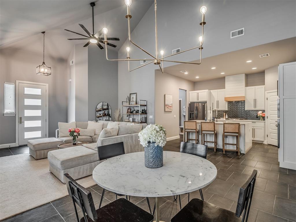 Upgrades galore in Deer Creek. Located in Deer Valley Estates you will find this meticulously upgraded modern 3 bedroom, 2.1 bathroom with 3-car garage home. Modern luxury upgrades from standard construction include: ceramic tile flooring throughout, upgraded tile quality and patterns, upgraded lighting fixtures, extended bathroom vanity in secondary bathroom, custom cabinetry, upgraded hardware, floor to ceiling concrete fireplace with mantel, remote operated ceiling fans throughout, additional gas line to backyard, and upgraded kitchen appliances. Through the front door you are welcomed with an open concept living space boasting soaring ceilings flooded with natural light. The large living area hosts a stately floor to ceiling gas fireplace that sits open to the dining and kitchen area. Kitchen features a built-in gas cooktop, custom tile backsplash and leathered granite countertops. Conveniently located just off the kitchen to garage entry are the half bathroom and the laundry which features additional storage, folding counter, and utility sink. The secondary hall bathroom with tub/shower combo and oversized vanity is appointed to service the 2 secondary bedrooms both featuring remote operated ceiling fans. The expansive Primary retreat sits at the end of the hall, has an en-suite spa like bathroom with jetted tub, penny floor tile, walk in shower and double vanity. Opposite the bathroom in the primary suite sits a swanky pocket office that could also be used as a sitting area or nursery. You will find the back porch spacious with plenty of room for enjoying evenings grilling out while the kids and dogs play in the backyard. Back fence line is not shared with a neighbor for added peace and privacy. This home is ready for a new family to make many lasting memories for years to come.