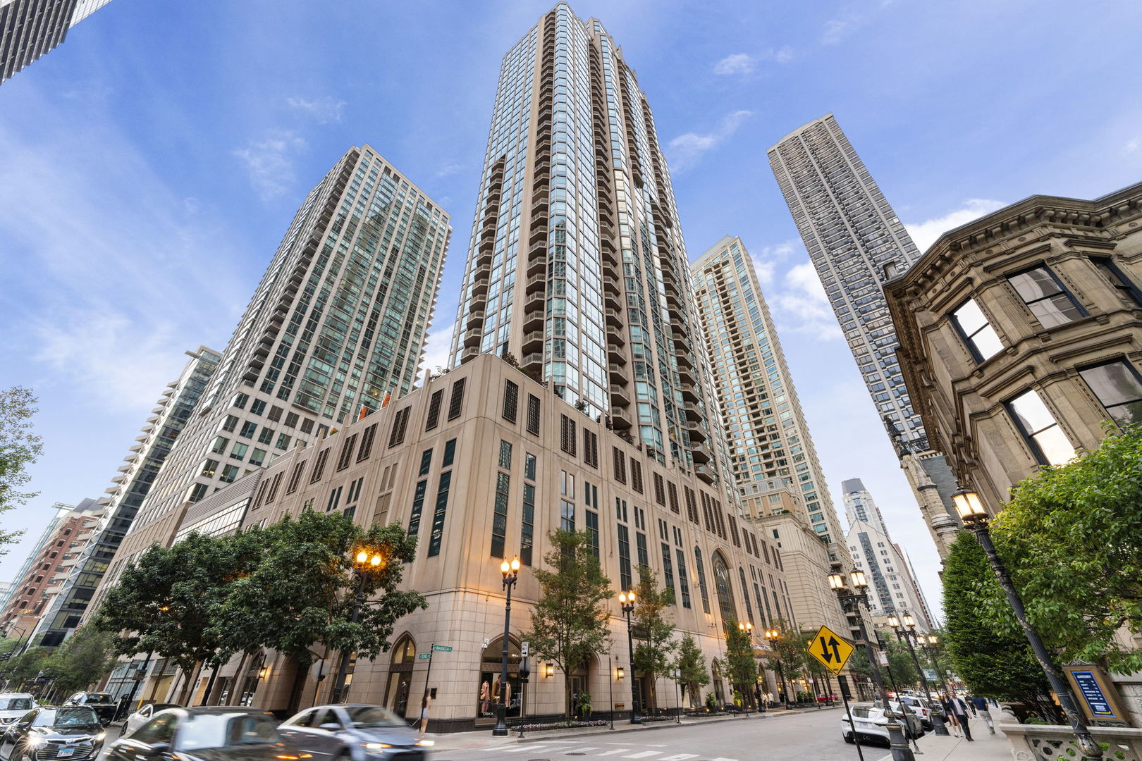 Luxury 37th-Floor Residence at The Pinnacle - River North High-Rise Living  Soar above the city in this spectacular 37th-floor home at The Pinnacle, one of River North's premier luxury high-rises. With uninterrupted east-facing skyline and lake views, this residence combines sophisticated design with modern convenience, creating a retreat that's perfect for everyday living and entertaining.  Expansive living and dining areas are framed by floor-to-ceiling windows and open to two private balconies, immersing you in Chicago's brilliance from sunrise to sunset. A recently renovated gourmet kitchen features top-of-the-line appliances, sleek white quartz countertops, and a breakfast bar-perfect for casual dining or hosting.  The flexible layout includes two primary suites positioned on opposite ends of the home for maximum privacy. Each offers a spa-inspired bathroom and generous wardrobe space. A third bedroom functions perfectly as a guest suite or home office, with a full bath and walk-in shower nearby.  Enjoy the convenience of in-unit laundry and two heated garage spaces (included in the price).  Residents of The Pinnacle enjoy world-class amenities: a state-of-the-art fitness center, indoor pool, spa, sundeck, private wine cellar, and 24-hour door staff. Outside your door, River North offers Chicago's best dining, art galleries, boutiques, and nightlife-all just steps away.  Whether you're seeking a primary residence, a luxury city retreat, or an investment in the heart of Chicago, this home delivers unmatched comfort, security, and style.  Elevate your lifestyle at The Pinnacle-schedule your private showing today