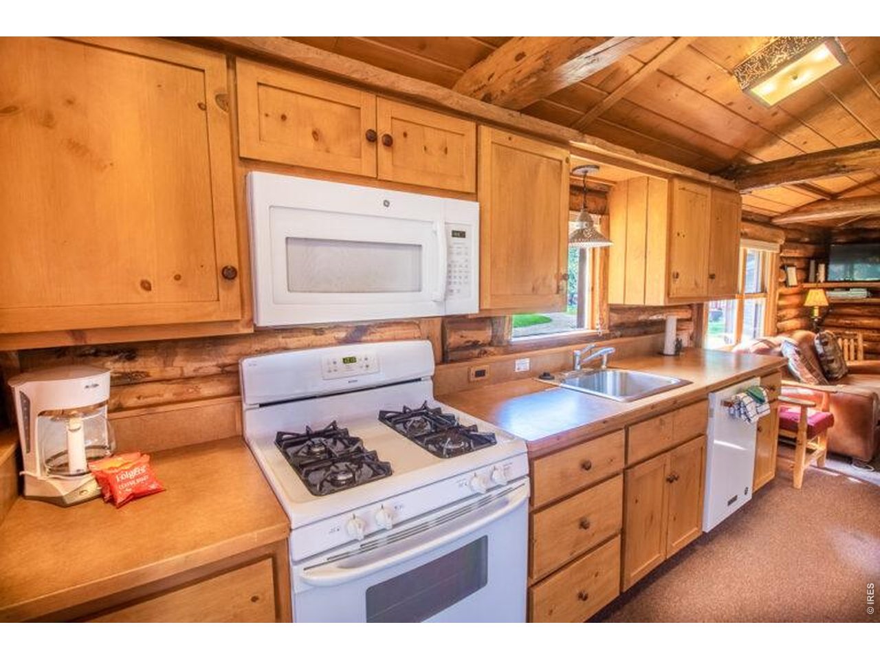 Escape to your own riverside retreat in the heart of Estes Park. Classic log cabin sits right on the river, where you can sip coffee on the deck, watch wildlife wander by, and unwind to the soothing sound of flowing water. Outstanding blue-ribbon flyfishing right off your private deck, overlooking the Fall River. Just minutes from Rocky Mountain National Park, downtown shopping, dining, and endless outdoor adventures. Grab the ebikes and head into RMNP or downtown on the hike & bike trail along Fall River. Successful 30-day rental commanding $3,000-5,000/month, this is the perfect place to add to your portfolio and reconnect with nature on your weekend getaways! The one you've waited for, let's explore today!