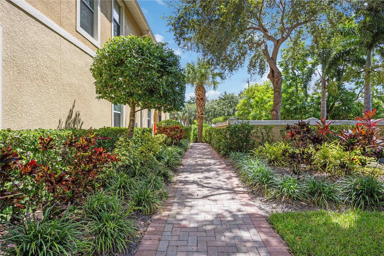 Enjoy the best of Sarasota’s Gulf Coast lifestyle from this beautifully maintained, move-in ready 3-bedroom, 2-bath condo with an attached one-car garage in the highly sought-after gated community of Stonehaven.Tucked away in a quiet, private setting, this ground-floor unit offers concrete block construction, hurricane impact windows and doors, and serene views from your screened lanai. It's ideal for year-round or seasonal living. Step inside to find an open-concept layout filled with natural light, soaring volume ceilings, and a spacious main living area that seamlessly connects the kitchen, dining, and living room. It’s perfect for entertaining or relaxing at home.The kitchen is both stylish and functional, featuring tall wood cabinetry, granite countertops, stainless steel appliances, and a peninsula breakfast bar that offers plenty of prep space and seating. Neutral tile runs through the main living spaces, while new luxury vinyl plank flooring adds warmth and durability to all three bedrooms.The spacious primary suite includes dual closets, a large step-in shower, and a linen closet, offering both comfort and convenience. Two additional bedrooms are located down a private hallway along with the second full bath and an interior laundry closet. Washer and dryer are included.Additional features include white plantation shutters throughout, HVAC replaced in 2021, and a paver driveway leading to your private garage.Tankless hot water heater installed in 2023, new garbage disposal and new garage door opener in 2024. Stonehaven is a pet-friendly, maintenance-free community with lush landscaping, a resort-style heated pool, playground, and low monthly fees that cover exterior maintenance, irrigation, and more. Located just one mile from I-75 and five miles from the white sand beaches of Siesta Key, you’ll also enjoy easy access to Legacy Trail, A-rated schools, shopping, dining, and all that Sarasota has to offer.This is a rare opportunity to own in one of Sarasota’s most convenient and charming communities. Don't miss it!