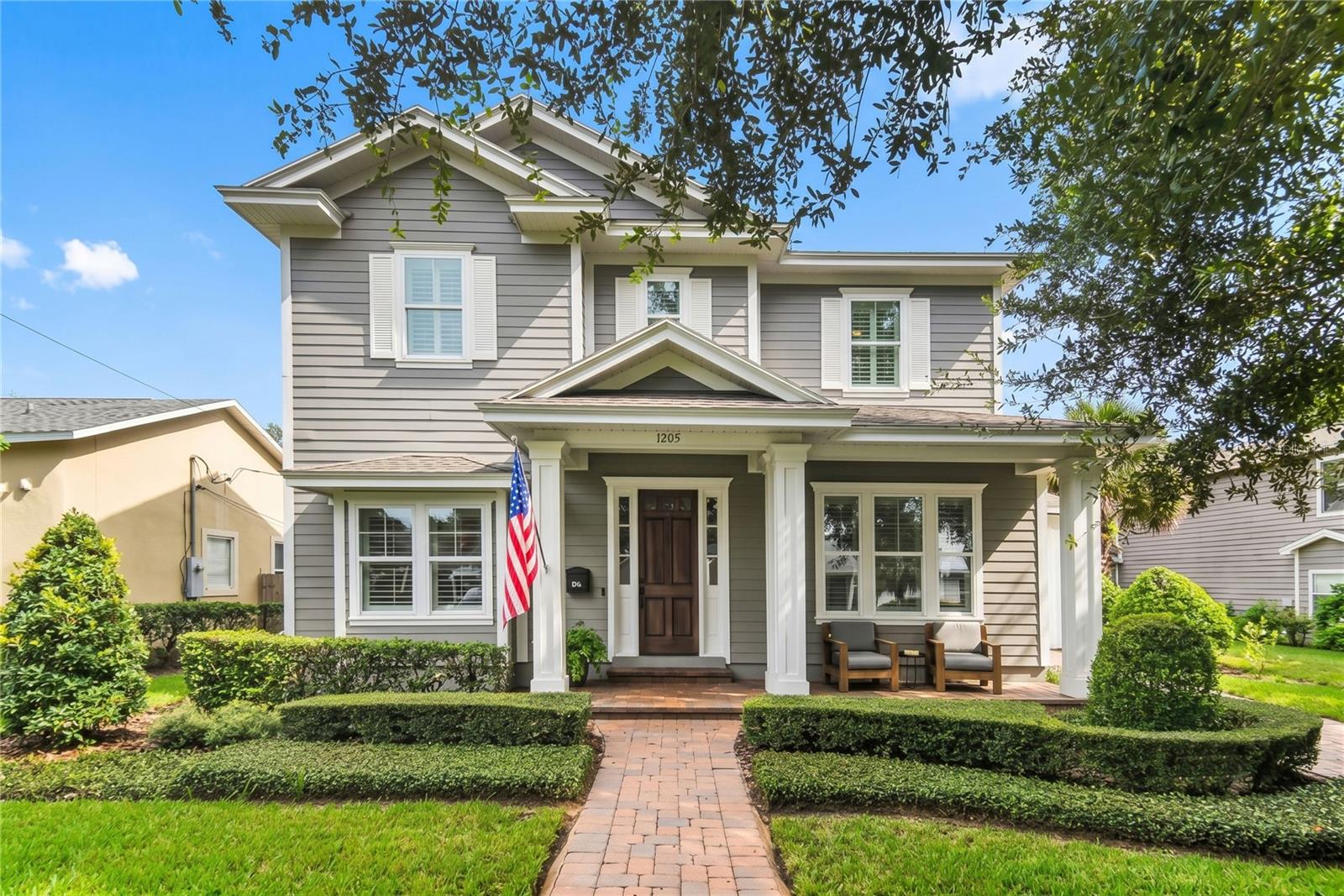 AN EXCEPTIONAL NEWER-ERA HOME IN THE HEART OF COLLEGE PARK. Perfectly sited on an expansive 75' x 136' homesite approaching 1/4 acre, this beautifully maintained home combines the scale and functionality of newer construction with the timeless character and architectural presence that make College Park homes so appealing.Built in 2015 as a custom residence by highly regarded Central Florida builder Silliman Homes, the home reflects thoughtful design, quality construction, and exceptional use of space. From its classic porte-cochère and established streetscape presence to the generous grounds surrounding the home, it feels entirely at home in the neighborhood rather than simply placed within it.Inside, the bright, open, and airy floor plan lives remarkably large and is flooded with natural light. The main living, dining, and kitchen areas connect seamlessly and open directly to the covered rear patio, pool, and beautifully landscaped grounds creating an effortless transition between interior and outdoor living. A six-room integrated A/V system further enhances the home’s entertaining capability. It is the kind of layout that works equally well for everyday family life and large gatherings with friends.The ground floor is exceptionally versatile, anchored by a generous and private primary suite retreat along with an additional guest suite and a third bedroom currently offering ideal flexibility as an office, den, or additional bedroom. Upstairs, a family-room loft is joined by bedrooms four and five and a full bath, providing another complete living zone within the home.The backyard is one of the property's defining features. Added in 2020, the pool and heated spa are surrounded by lush, mature landscaping that creates a remarkably private subtropical setting. Combined with the covered rear patio and expansive yard, the entire outdoor environment feels like a natural extension of the interior living space... peaceful, beautifully composed, and perfectly suited for entertaining, recreation, or simply enjoying the Florida lifestyle.The homesite itself further distinguishes the property. At approximately 75' x 136', the lot gives the residence the breathing room, privacy, and proportion that allow both the home and outdoor spaces to feel substantial without losing the warmth and intimacy of the neighborhood.Recent improvements include the 2020 pool and heated spa and a 2023 HVAC system, complementing a home that already offers the room count, functionality, and lifestyle of much newer construction.Ideally positioned between Edgewater Drive and The Packing District, the location puts some of College Park's best amenities close at hand, including neighborhood parks, lakes, restaurants, shops, recreation, and community gathering places. Downtown Orlando, Winter Park, AdventHealth, Orlando Health, and major roadways are all just minutes away.And beyond the floor plan and features, the photos tell the rest of the story. A rare opportunity to secure a substantial College Park residence offering timeless architectural character, a highly functional five-bedroom floor plan, exceptional outdoor living, and the space and privacy of an unusually generous homesite.