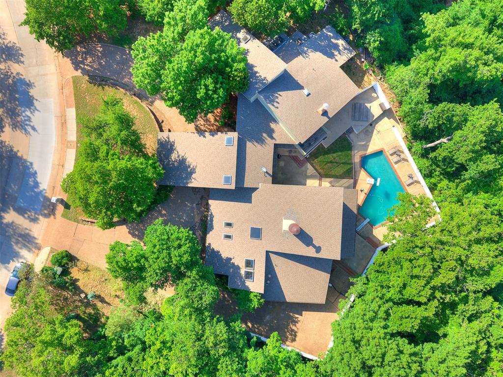 Opportunity is knocking in the legendary Oak Tree neighborhood, hosts of the 2027 Senior PGA Championship.  This home was originally given the title “The First Million Dollar House in Oak Tree” and it is ready to meet and very possibly exceed that expectation.  This 5184 square foot home sits on a large private 0.91-acre lot, giving the owner an enviable amount of privacy when enjoying the pool and the additional outdoor living space. The home boasts one of the better entertainment spaces you can imagine in the living area and a very large master suite with fireplace and two doors out to the pool area.  The additional bedrooms on the lower level are jack and jill style.  The 4th bedroom is upstairs and includes a private deck overlooking the pool area and is adjacent to partially finished space that, when finished out, would add several hundred square feet to the property.  This house and land in Oak Tree is listed at $115 per square foot in a market and neighborhood that demands a much higher price. Due to the current price at $75 a square foot less than neighborhood comparables, this home is being offered "As-Is".