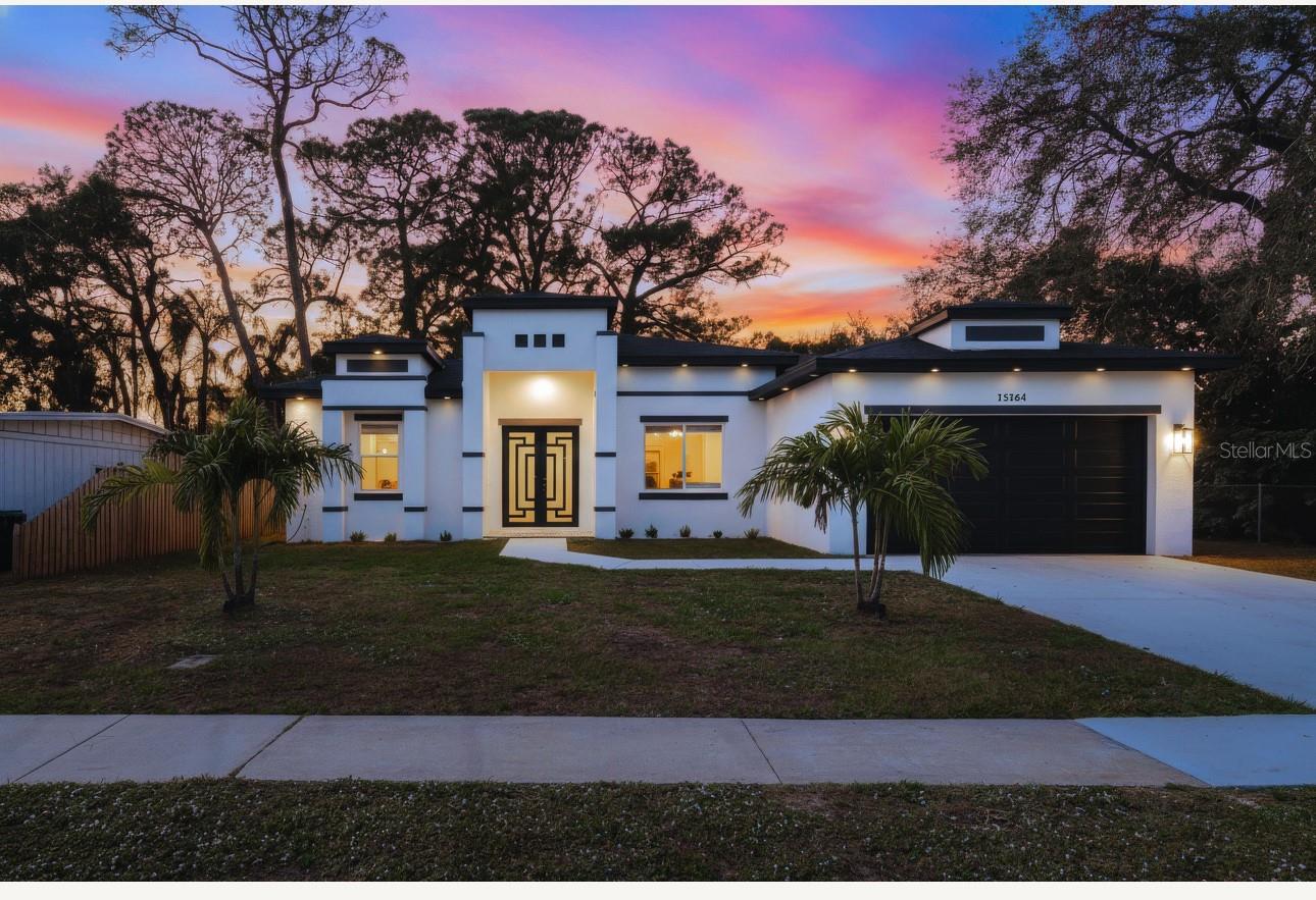 Welcome to this stunning brand-new construction home, completed to perfection and offering serene lake views right from your backyard. This beautifully designed residence features an inviting open layout, high ceilings, a spacious backyard, and a double-car garage. Inside, you’ll find a well-appointed laundry room and modern finishes throughout. The expansive primary bedroom is a true retreat, showcasing dual walk-in closets and a luxury spa-like bathroomfeaturing dual sinks, a relaxing soaking bathtub, and a separate shower. Ideally situated close to shops and located outside of any flood zone, this home delivers both comfort and peace of mind. Move-in ready and crafted for today’s lifestyle, this property is a must-see!