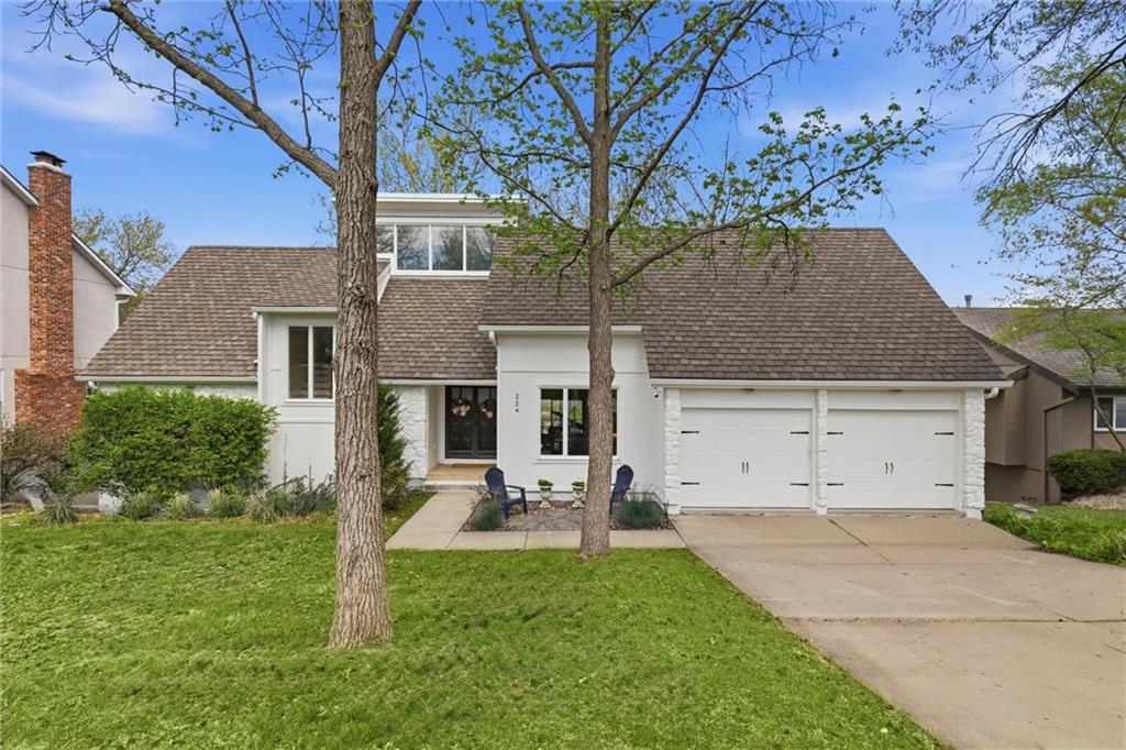 Welcome to a rare lakefront opportunity in Lee’s Summit! This 5 bedroom home is positioned on a peaceful cove and blends comfort, scenic views, and an elevated lake lifestyle. Stunning water views flow throughout the home, enhanced by real hardwood floors, large windows, vaulted ceilings, and multiple living spaces designed for both everyday living and entertaining. The main level primary suite offers both convenience while the flexible floor plan provides generous bedroom sizes, multiple gathering areas, and ideal separation for multigenerational living, guests, or work from home needs. Three additional bedrooms and one full bath are upstairs, and one enormous bedroom and bath reside in the lower level off a multipurpose recreational room. Several fireplaces throughout the home add warmth and character, and laundry on every level brings practicality rarely found in lakefront properties. Ample storage ensures plenty of space for organization and future customization! Multiple decks and patios overlook the water, creating the perfect setting for morning coffee and evening sunsets. The cove offers easy access to the water while still connecting you to the main channel for boating, kayaking, and paddleboarding. A spacious two car garage with an additional third lakeside garage provides exceptional functionality with direct water access ideal for storing lake gear, recreational equipment, and more. BONUS! $3,000 seller paid allowance for yard/landscaping or apply towards closing costs! Located in the highly sought-after Lakewood community, residents enjoy access to boating, golf, tennis, pickleball, walking trails, two swimming pools with water features, playgrounds, and clubhouse amenities. The home is also within award-winning schools and offers convenient access to shopping, dining, and major highways.