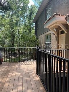 This exquisite, 3-bedroom, 2.5-bath, 2-car garage, end-unit townhome (the most desirable unit in the complex) combines elegance and sophistication with complete PRIVACY and an unparalleled living experience in the heart Tampa Palms. Nestled in the highly sought-after, gated community of Palma Vista, this home provides close access to I75, hospitals, USF, shopping and vibrant dining options. Upon entering through the elevated walkway, you are immediately greeted by beautiful and unique architectural features. The unit is completely soundproof ensuring valuable tranquility with conservation views from every window. The soaring ceilings enhance the open and airy feel, with plantation shutters throughout the home. The kitchen has new LG stainless steel appliances (dish washer, refrigerator, stove/oven, microwave, washer/dryer), 42-inch cabinetry, and gorgeous granite countertops All three bedrooms are generous to huge, easily accommodating king sized beds and much more. One upstairs bedroom is ensuite. An upstairs office with conservation views is perfect for work at home or a child’s play area. Two wall-mounted Sony TVs will convey to new owner. AC unit cools the entire townhome in minutes with both downstairs and upstairs controllers. Palma Vista offers a maintenance-free lifestyle, with a reasonable monthly HOA fee that INCLUDES the tile roof, exterior painting, cable, internet, lawn care, and twice-weekly trash removal. With ample visitor overflow parking spots, your guests will always have a place to park. The location of this community is unmatched with gorgeous, naturally-shaded walking areas and zoned for top-rated A+ schools including nearby University of South Florida. NO FLOOD INSURANCE is required of the owner, and the community experienced zero hurricane damage from storms Helene and Milton. With a perfect blend of luxury, comfort, and convenience, this home and community offer an ideal living experience.