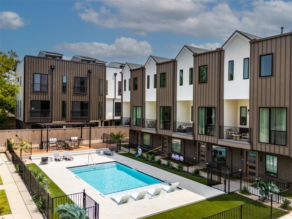 Middle UNIT WITH COMMUNITY POOL, BBQ PLACES, ADDITIONAL FIRST FLOOR FLEX ROOM WITH ELEGANT INTERIOR AND EXTERIOR SPECS. Midtown Heights, where sleek modern style meets vibrant city living, offers a community pool and BBQ areas, perfect for relaxation and entertaining. Step into this beautifully designed 2-bedroom, 2.5-bath townhome with an office-flex space on the first floor overlooking your private front yard. The open-concept layout flows effortlessly into a contemporary kitchen with high-end appliances, while a private balcony provides a serene view of your fenced yard. The large master bedroom features a flex space niche, a spacious bathroom, and a walk-in closet, offering both comfort and functionality. Real hardwood flooring runs throughout, and high ceilings with tall doors enhance the sense of space. A 2-car garage with EV charging and a private front yard adds both convenience and curb appeal. Located near the city's best nightlife, dining, and entertainment, it's close to Uptown, Downtown, Katy Trail, Henderson Ave, Lower Greenville, The Central, and Deep Ellum.