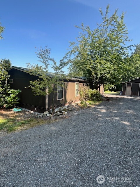 Fantastic Mountain View! This 5+Acs, 1782Sf Home Features: 3Bds/1&3/4Bas, Primary Bd, w/Walkin Closet, w/att Ba, two other bedrooms, Full Ba, sits on opposite side of the home, Kitchen w/eating sp. Dining Rm. Living Rm w/Woodstove (Elec start), Utility Rm w/New WH, All Appliances stay, New Furnace, (AC Ready), Large Trex Deck overlooking the Property & Mountain View!  The Home has a Metal Roof, as do all Buildings, and all are painted the same!  LG Garage/Shop, Att/2 covered Bays for Storage/Animal Pens & more!  Bonus Building w/Elec, (Many possibilities)!  Well House, 252Ft deep, Tankless system, Insulated, Elect, Sheetrocked for Storage!  Chicken Coop. Att/Feed Rm, 3 Bays for Storage, Pens, Kennels??  This is a MUST SEE to Believe, HURRY!