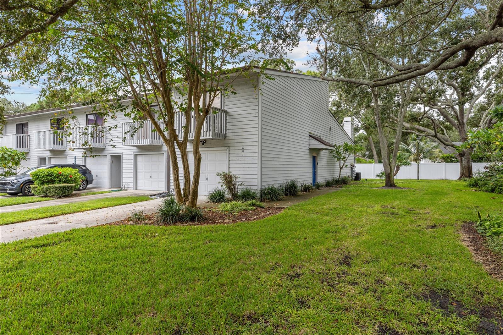 One or more photo(s) has been virtually staged. Welcome to this beautifully maintained 2-bedroom, 2-bathroom end-unit townhouse offering maintenance-free living—and it's not located in a flood zone! This spacious tri-level home features an oversized 1-car garage with abundant storage and a driveway that accommodates multiple vehicles. On the first level, you’ll find a versatile bonus room—perfect for a home office or workout space—along with a washer and dryer and additional storage. The second floor boasts stylish, vinyl plank flooring throughout. The kitchen is equipped with a newer range and refrigerator, butcher block countertops, and a breakfast bar that opens into the dining area. The sunken living room features vaulted ceilings with skylights that fill the space with natural light, a wood-burning fireplace, and access to a screened porch—ideal for relaxing outdoors. Both bedrooms and bathrooms are located on the third floor. The primary suite includes built-in shelving in the closet, a private balcony and an ensuite bathroom with a new sink and vanity. The HOA fee of $648 a month covers the heated pool, exterior maintenance, reserves fund, roof, grounds maintenance, sewer, water, trash, cable, internet, and private road—truly low-maintenance living! Work has begun on putting new, exterior siding on the buildings. The community is directly across the street from Forbes Recreation Center and Helen Howarth Community Park, featuring a dog park, playgrounds, picnic pavilions, ball fields, and walking/horse trails. It’s also conveniently located near I-275, restaurants & shopping; two international airports; award-winning Gulf beaches; and the vibrant downtowns of St. Petersburg & Tampa. Don’t miss your chance to own this turnkey townhouse in a prime location with everything you need right at your doorstep!