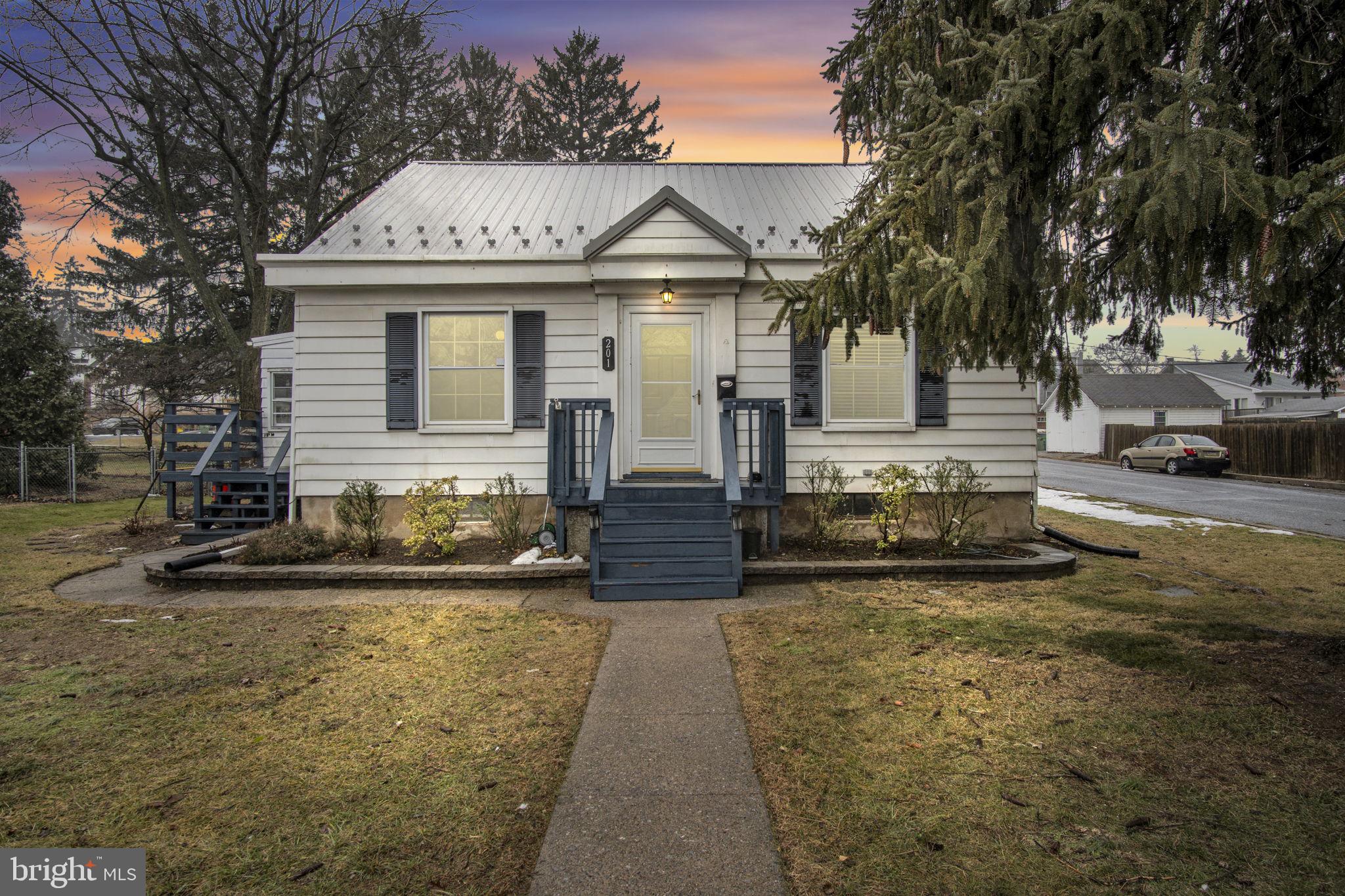 This Cape Cod is the home you were waiting for. It sits on a fenced corner lot in a quiet, convenient neighborhood close to shopping, schools, and highways. The home features original hardwood floors, updated bathrooms, and charming arched doorways that offer great character throughout. Enjoy the abundance of natural light, especially in the sunroom. Super cute and inviting, it also includes a gas fireplace, two decks for outdoor entertaining, a great yard with a fire pit, off-street parking, new detached garage, and a new roof. This home is the perfect blend of charm, comfort, and convenience— an easy place to feel right at home.