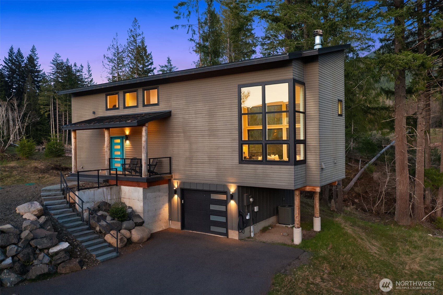 Welcome to the Creekside. Built in 2021, this immaculate modern alpine retreat is located just minutes from town center in Packwood’s premier gated neighborhood, Hideaway. The clean architectural lines and advanced building materials offer the perfect juxtaposition with the rugged natural beauty of Mt. Rainier and the ever-babbling creek safely flowing past the firepit gathering spot. Inside, you’ll love the stunning granite slab as the focal point of the open kitchen and dining area. The seamlessly connected great room features a towering two-story wall of glass looking West down the Cowlitz River Valley and a tremendously efficient Quadra-Fire wood burning fireplace. Both the main level bedroom and second level bedroom offer breathtaking views of Mt. Rainier. The spacious bunk room offers a flexible sleeping area for all ages. A tuck-under garage is ideal for storing your outdoor recreation equipment and includes an EV charger for you or your guests to reenergize before enjoying another adventure in the Gifford Pinchot National Forest. Pre-inspected and offered fully furnished, this home is the perfect turn-key STR with which you can realize a swift return on investment as the peak summer season approaches for international visitors to Mt. Rainier National Park. Located only 25 minutes from the National Park and White Pass Ski Area, the Creekside is your base camp to the Cascade Mountains.