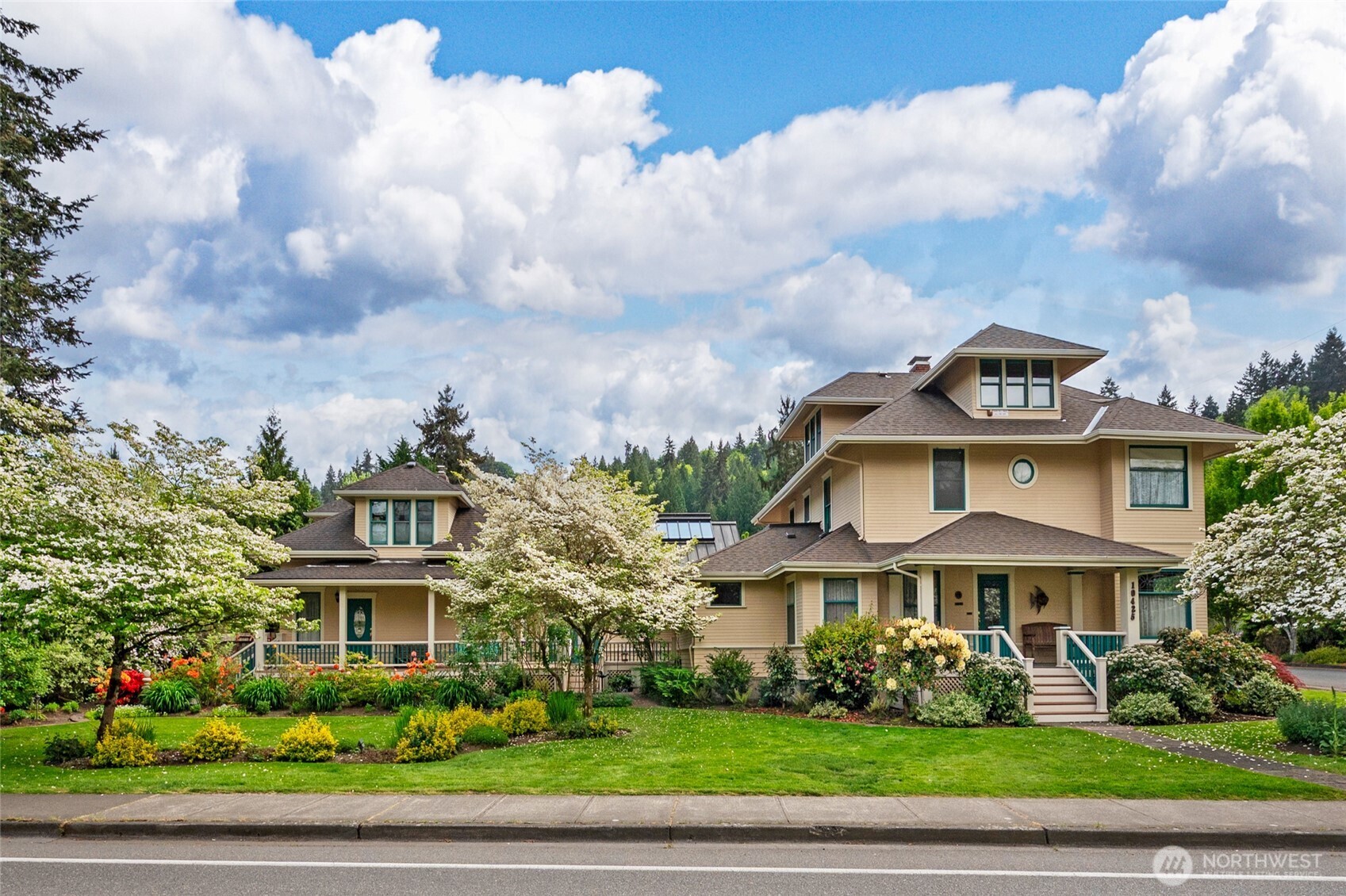Discover a rare Bothell treasure: a beautifully preserved historic home seamlessly connected to a second residence through a bespoke, light-filled atrium. This unique architectural pairing creates an exceptional estate perfect for multi-generational living, extended-stay guests, private retreat center or returning to the second home’s legacy as a charming bed and breakfast. The primary home showcases timeless craftsmanship, and thoughtful updates. Offering 2,700 sq ft, 3 bedrooms, and 2.5 baths including a primary suite. Additional highlights include a finished attic space, welcoming formal living and dining rooms, and a spacious cook’s kitchen with walk in pantry that opens to the family room - creating an ideal space for gathering and daily life. Step through the custom designed and light filled atrium and you’ll arrive at the second residence, with the same timeless character. Here you will find 2,993 sq ft, 4 bedrooms each with their own en-suite, a living room, kitchen area, and ½ bath. Set on a stunning half acre lot, the property offers mature landscaping, and a peaceful outdoor living space. An additional 740 sq ft 1 bedroom, 1 bath detached unit adds versatility - ideal for a studio, quest house or rental income. With a 2-car garage, and parking for 11+ vehicles, the estate easily accommodates guests. This exceptional property combines history, hospitality, and flexibility - an opportunity seldom seen in Bothell and impossible to replicate.