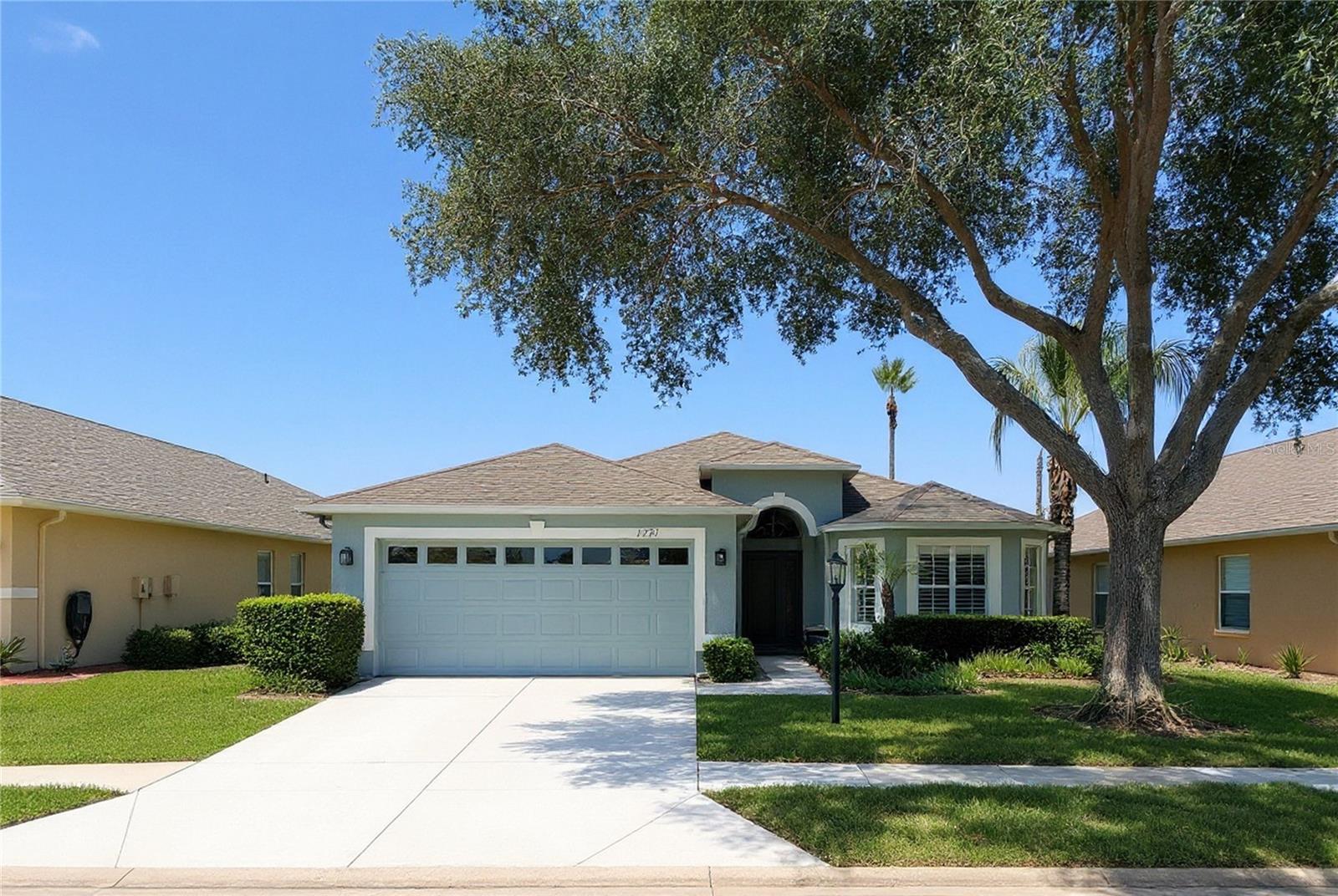 Welcome to your peaceful retreat! Nestled in a highly desirable, gated 55+ community, this beautiful 3-bedroom, 2-bathroom home offers the perfect blend of privacy, exceptional storage, and peace of mind. As you approach, you're greeted by the serene view of a peaceful retention pond right out front. Step inside to a bright, open-concept living and dining area designed for seamless entertaining and everyday comfort. The spacious kitchen boasts classic wooden cabinetry with abundant storage space. Retreat to the generous primary suite, complete with an impressive walk-in closet, while the two additional bedrooms both feature plenty of closet space of their own. Storage is a major highlight here, with two dedicated hallway closets and a separate laundry room. Outside, you'll find a spacious 2-car garage, while the major mechanics are already taken care of with a newer water heater and a newer air conditioning handler. With no rear neighbors, you can enjoy quiet serenity and ultimate privacy right from your backyard. Best of all, its prime location near the community entrance ensures quick and easy access in and out of the neighborhood.