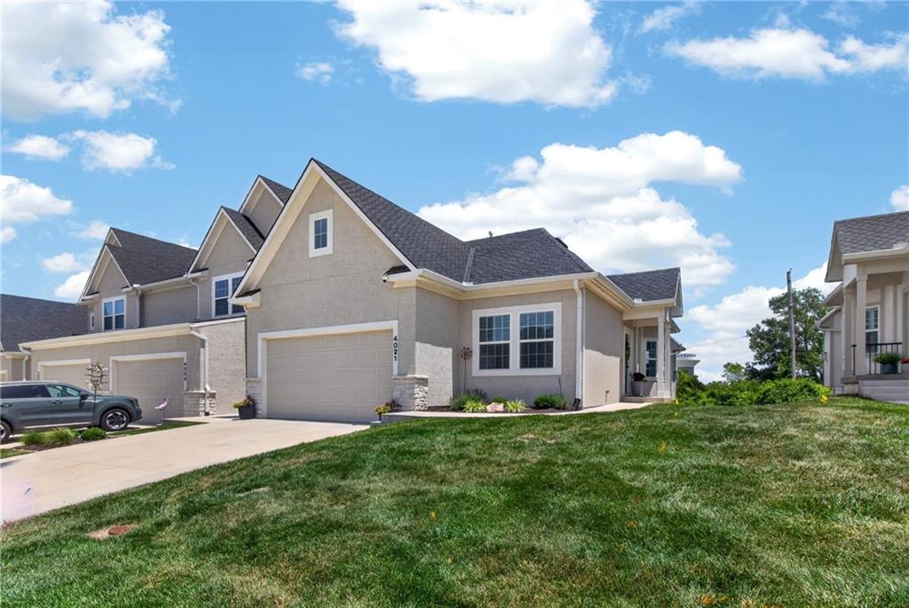 Available for showings July 9th. Welcome to Chapel Ridge Woods in the highly sought-after Lakewood community! This nearly new ranch-style town home offers the perfect blend of luxury, comfort, and low-maintenance living. Featuring 3 bedrooms, 3 full bathrooms, and over 2,200 finished square feet. The main level showcases a stunning kitchen with custom cabinetry, custom countertops, a large island, stainless steel appliances, and a cozy living room anchored by a gas fireplace. The large windows in every room offer a lot of natural light to the home. This beautifully designed home also includes a finished walkout lower level, spacious open-concept living areas, and high-end finishes throughout. The finished basement expands your living space with an additional bedroom, full bath, and large recreation area perfect for entertaining guests, or everyday living. Step outside to enjoy one of the home's standout features—a beautiful, elevated deck overlooking the backyard, providing the perfect setting for morning coffee. The fenced backyard offers added privacy and space for pets, relaxation, or outdoor enjoyment. As a resident of Lakewood, you'll enjoy access to exceptional amenities including lake privileges, boating, golf, swimming pools, tennis courts, fitness facilities, walking trails, clubhouses, and more. Combined with maintenance-provided living, this home offers an unmatched lifestyle in one of Lee's Summit's premier communities. This amazing opportunity is located at 4021 NE Sagamore Drive Unit D, Lee's Summit, MO 64064.