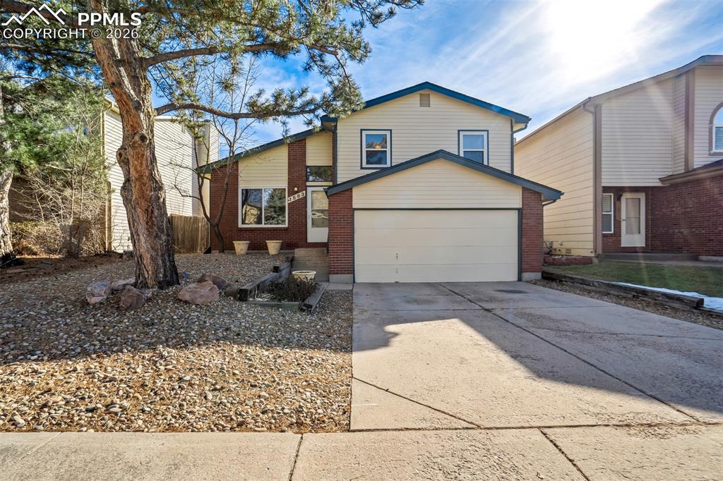 Beautifully maintained split-level home offering 3 bedrooms, 1.5 baths, plenty of comfortable living space. This inviting property features a bright and open layout with a cozy fireplace that anchors the main living area. The front and back yards are fully landscaped, complete with a raised garden bed perfect for growing your own vegetables. Enjoy convenient proximity to local schools, UCCS, and multiple nearby parks, making this an ideal location for both daily living and outdoor recreation. A wonderful opportunity for anyone seeking a charming, well-kept home in a prime setting! (The square footage for the main and the lower level are estimated based on the rooms as the assessor record combines the two into one.)