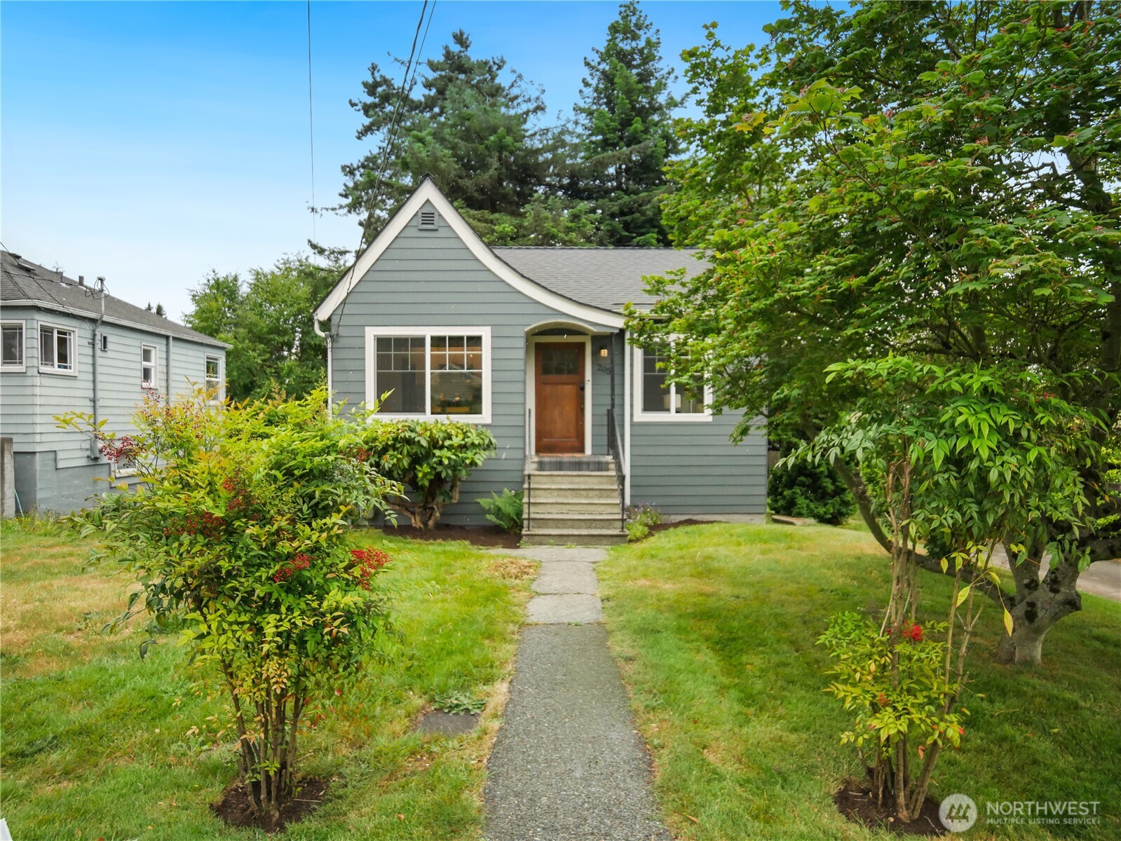 Step into the perfect blend of classic charm and modern comfort in this tastefully remodeled vintage home. Thoughtfully updated from top to bottom, it features brand-new cement board siding, a new roof, energy-efficient windows, a gas furnace, and an on-demand water heater for peace of mind and year-round efficiency. Inside, you’ll find a modern & open new kitchen designed for both everyday living and entertaining, complete with gas cooking, stainless steel appliances, and classis granite countertops. There is also a spacious dining area. Original character shines throughout with hardwood floors, coved ceilings, and a vintage fireplace that anchors the living space with warmth and style. The lower level offers a spacious bonus/entertainment room—perfect for movie nights, hobbies, or a home office and the 2nd bedroom. Step outside to a large yard and expansive deck, ideal for gatherings, gardening, or simply relaxing. There is a long driveway providing plenty of off- street parking. Conveniently located with excellent access to public transportation, this move-in-ready home offers the best of both worlds: timeless appeal and modern upgrades.