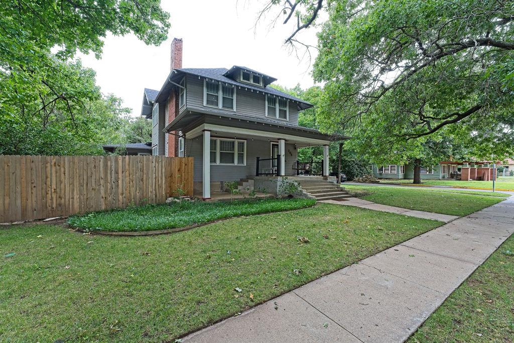 WOW! This is an amazing craftsman style home built in 1920 is approximately .5 miles from OU and Campus Corner.  The home has all the charm of the era with many updates of the modern day. It has lots of natural light with ALL the windows.  It boasts 4 true bedrooms and 2 bathrooms; however, the downstairs study is being used as a 5th bedroom. The kitchen has been updated with solid counters, double ovens, and updated fixtures, including a pot filler over the stove.It has gorgeous wood floors, amazing stained woodwork, and large rooms.  The staircase has two access points from the living and dining.  This home sits on a large corner lot and has a detached 2-car detached garage from the side street.  The large mature trees shade the home and create an aesthetic look which is extremely rare.  The screened back porch opens to a massive backyard. The basement is accessed from the exterior and makes a great area for storms. The fencing on the north side of the home was replaced 7-20-26.  This home is currently rented for $3,750 a month through 5-24-27, however it is a perfect place for a new Buyer to call home and owner occupy.