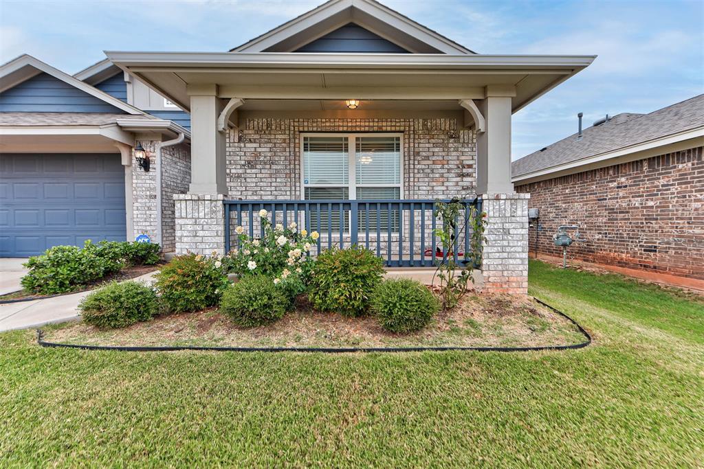 Welcome home to this beautifully maintained 3-bedroom, 2-bath residence offering 1,854 sq. ft. of thoughtfully designed living space in the desirable Valencia community of Edmond. Built in 2021, this home combines modern comfort with stylish updates throughout. The spacious living area features upgraded taller baseboards and added ceiling fans, while the kitchen showcases ceiling-height cabinetry, custom lower drawers, and a convenient mudroom nearby. The primary suite includes a custom shoe shelf in the closet and framed mirrors in the bathroom for a polished touch. Outdoor living is enhanced by the expanded back patio, screened and glass doors at the front and back, and concrete walkways added along the side of the home. Additional features include a storm shelter, upgraded laundry cabinets, and a welcoming front porch perfect for relaxing evenings. Valencia residents enjoy community ponds, parks, walking trails, and a splash pad—creating the perfect blend of comfort and lifestyle.