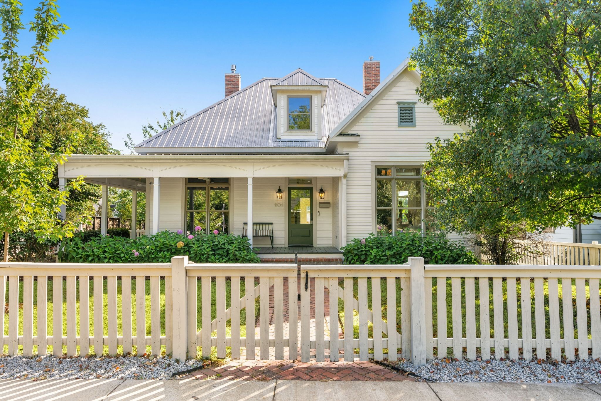 A one of a kind historic renovation where timeless character meets modern luxury - This home has been beautifully reimagined while honoring its original charm.

Perched on a quiet corner lot with a spacious yard and a new DADU, every inch of this property showcases thoughtful design and craftsmanship. The main home features a new living room addition, a fully renovated kitchen with designer appliances, and a covered back porch with a gas fireplace - ideal for entertaining year round. Inside, designer lighting, antique doors, and new hardwood floors blend effortlessly to create warmth and sophistication throughout.

Just one block from Nashville’s iconic 12 South, enjoy unmatched walkability to neighborhood favorites - boutiques, coffee shops, and the city’s best dining are all at your doorstep. This home is a rare find in one of Nashville’s most sought after locations.