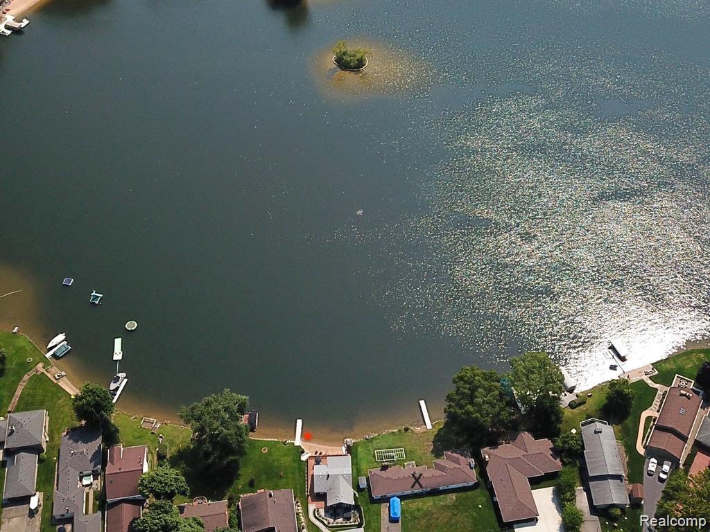 Woodland Lake 112 feet of waterfront. Beautiful sunrise views. One of the larger lots on this all sports lake. Sprawlings 2,046 square foot ranch with 2 bedrooms and 2 full baths. Large recreation/bonus room.  Past update include furnance/ac, well, and roof. Cul-de-sac location. Minutes to downtown Brighton, shopping, restaurants, recreation, hospital and I-96 / US23. Come enjoy the serenity, beauty, and all sports waterfront living.