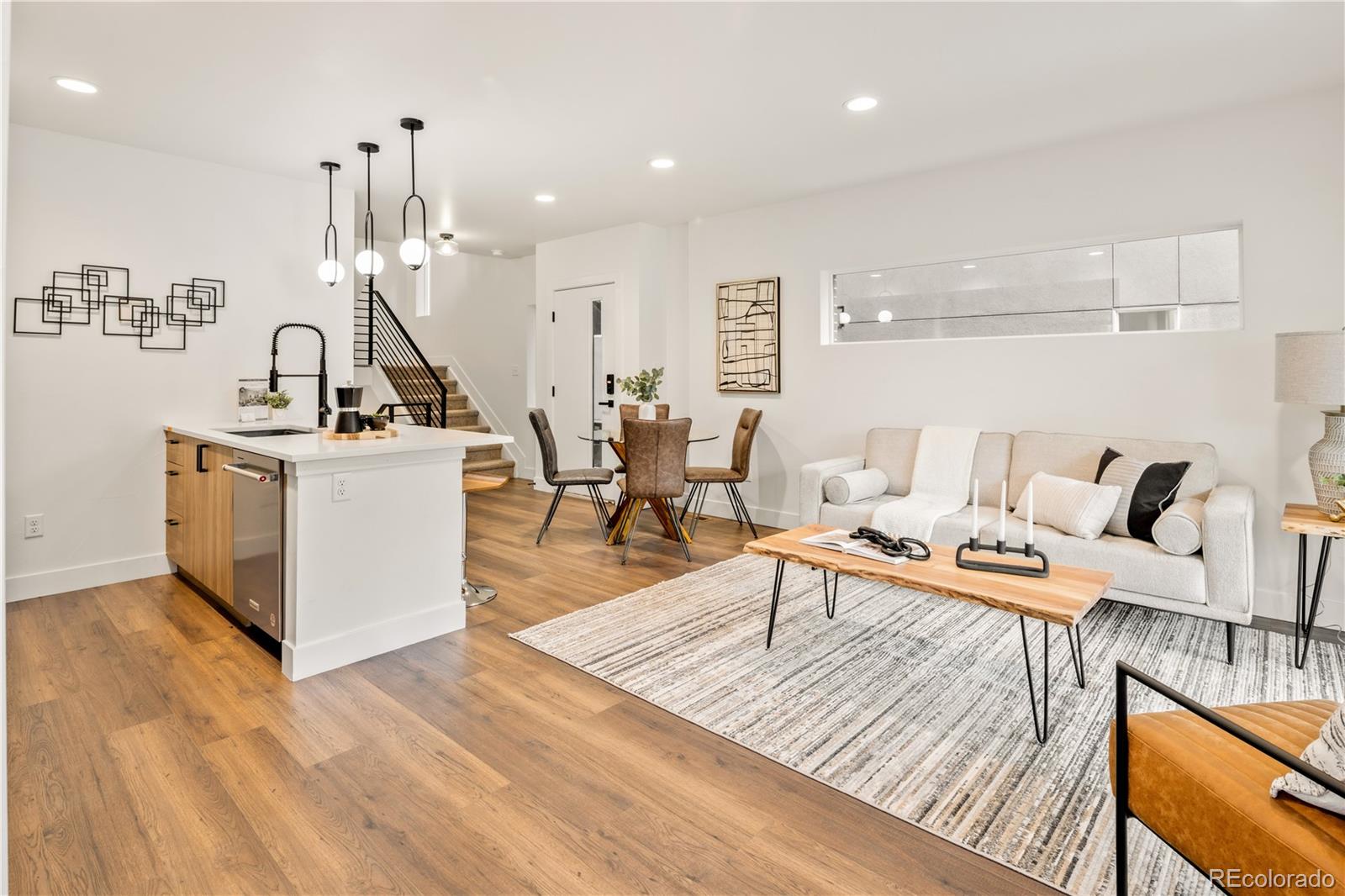 Welcome to 1344 Knox Court, a move-in ready home that backs directly to Paco Sánchez Park in one of Denver's most dynamic neighborhoods. Thoughtfully designed, this three-story unit offers strong value, livability, and location.
With 1,906 square feet of living space, the home includes three bedrooms, three and a half bathrooms, a lower-level bonus room with a wet bar, and a layout ideal for a second family room, gym, or guest suite. Unlike many comparable properties, 1344 features a fully landscaped real grass front yard and direct park access, blending privacy with outdoor connection.
The interior boasts upgraded finishes: luxury plank flooring, vaulted ceilings, gas range, stainless steel appliances, soft-close cabinetry, and quartz countertops. The kitchen flows into a bright, open living area with bar seating, perfect for daily living or entertaining. A custom open-tread staircase with a sleek metal railing adds architectural appeal. The primary suite offers a walk-in closet with built-ins and an en-suite bath with dual vanity and a large walk-in shower.
Three outdoor living areas, including a main-level patio, a covered balcony off the primary suite, and another off the second bedroom, provide comfortable spaces to relax.
As the front unit, 1344 features a private entrance, abundant natural light, and curb appeal. It stands out within the four-home collection for its visibility and connection to the green space.
Additional highlights include a tankless water heater, energy-efficient windows, and central A/C.
Located just steps from parks, trails, and playgrounds, and minutes from Sloan's Lake, West Colfax, Edgewater, and the Decatur Federal Light Rail Station, the setting is ideal for lifestyle and commuting.
1344 Knox Court is positioned to capture buyer attention with its thoughtful design, premium finishes, and direct park access.
Do not miss this chance to own one of the most well-located and livable homes in the neighborhood.