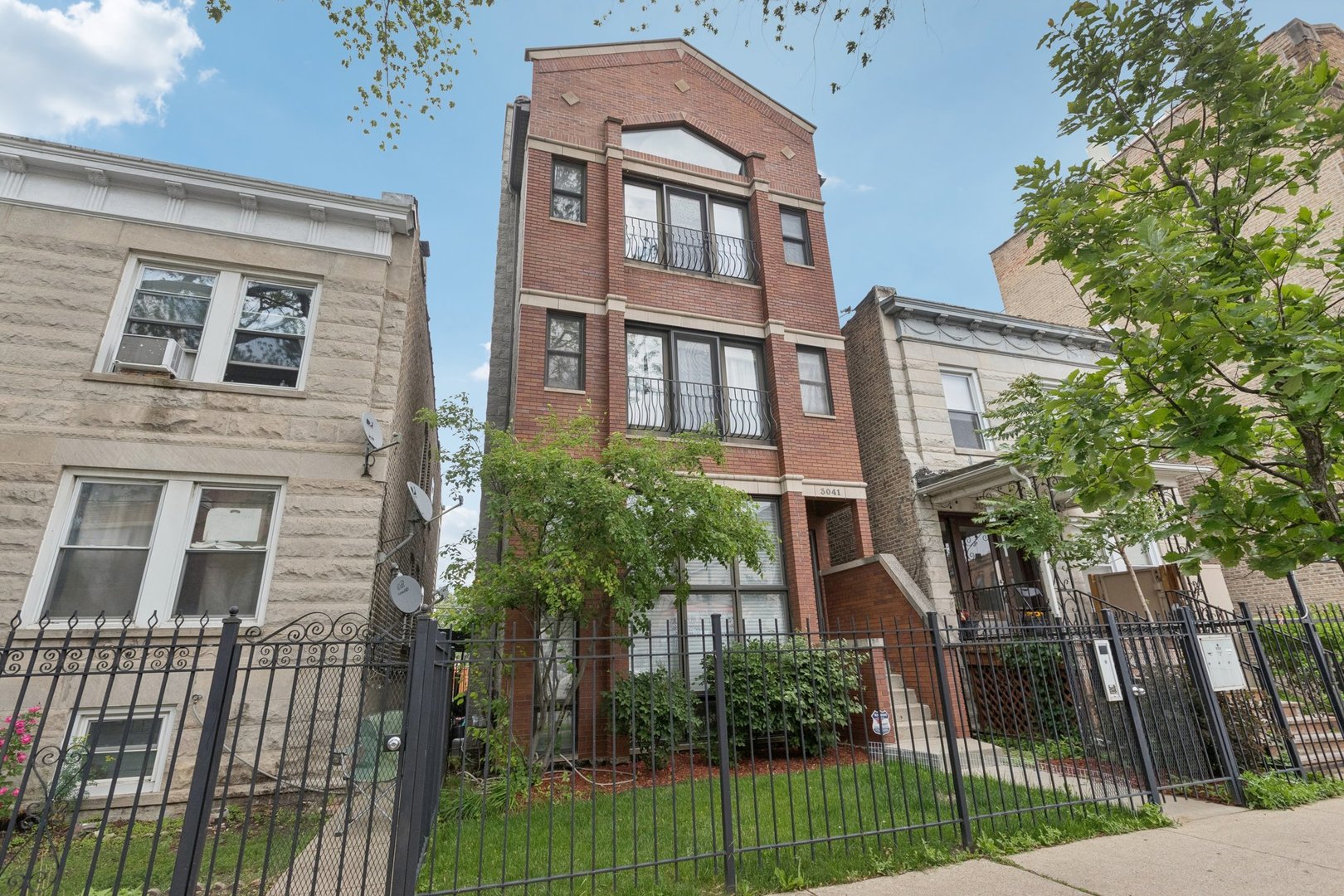 Welcome to 3041 N. California Ave Unit 1 - a spacious and well-maintained 3-bedroom, 2.1-bath duplex down condo located in the heart of Chicago's vibrant Avondale neighborhood. With approximately 2,300 square feet of beautifully finished space, this home offers the perfect blend of modern comfort, thoughtful updates, and functional layout for both entertaining and everyday living.    The main level features an open-concept layout filled with natural light, anchored by a cozy wood-burning fireplace in the living area. A full dining room flows seamlessly into the updated kitchen (2023), stainless steel appliances, granite counters, and warm wood cabinetry. Off the main hall, you'll find a convenient updated (2021) half bath for guests and a spacious primary suite with a private balcony, primary bathroom updated (2021 )with double vanities, walk-in shower, and large jacuzzi tub - perfect for winding down after a long day.    Downstairs, the lower level welcomes you into a large, sunlit family room with tall windows, plush new carpet (2024), and a second wood-burning fireplace. Two additional bedrooms, a full bath updated (2021), laundry room, and assigned storage space in a common area complete the lower level.    This home has been freshly painted (2025) and includes additional upgrades like a new ejector pump (2024), roof (2024), fireplace flue cleaning (2022), and master bedroom carpet (2019). Other improvements include a rebuilt deck (2021), resealed windows (2021), and updated bathrooms (2021).    Included are two tandem exterior parking spots. Building is self-managed with low HOA dues of $342/month, covering water, common insurance, and electricity. All lawn and snow maintenance is handled by owners. Roof was re-done in October of 2024. No rental restrictions (Airbnb prohibited), this 3-unit building is fully owner-occupied currently and well cared for.    Enjoy easy access to the Kennedy Expressway, CTA Blue Line, and the best of Logan Square and Avondale dining, shops, and nightlife - all just steps away!