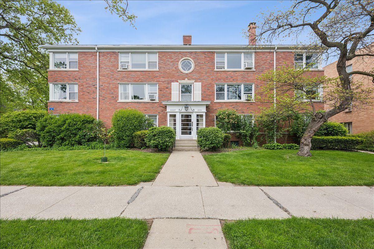 Welcome to your sunny little slice of Evanston. This charming top-floor 2 bed, 1 bath condo has gorgeous newly refinished red oak hardwood floors, tons of natural light, real dining space, great storage, and a neighborhood that makes you want to stay local all weekend. The well appointed kitchen features newer appliances and counter seating that opens into a spacious dining room ready for dinner parties and  takeout nights, The bright three-season room is the perfect flex space for a home office, reading nook, plant paradise, or morning coffee spot. The lovely stone bath includes a walk-in shower, and there's abundant attic and basement storage for bikes, holiday bins, and everything else you swear you'll organize someday. One dedicated parking spot included and free laundry in the basement!  Set in a quiet, well-maintained building in northwest Evanston, you're just blocks from the Central Street Metra and some of the neighborhood's best spots: grab coffee at Backlot Coffee, pastries at Tag's Bakery, and rooftop tacos and margaritas at Comida. Tennis courts, summer concerts, and green space at Ackerman Park and Independence Park are right nearby. Warm, welcoming, and perfectly Evanston, this is the kind of home people hope will hit the market.