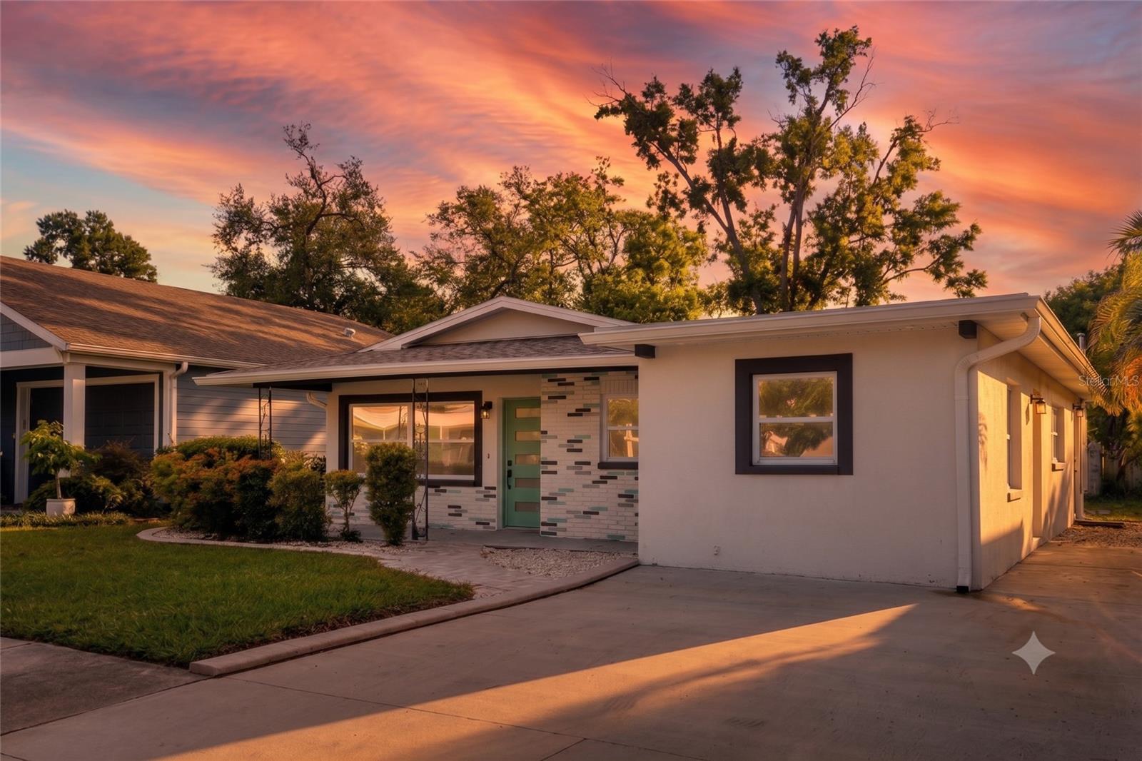 Virtually Staged. Searching for the combination of complete peace of mind and unparalleled convenience in Tampa? This turnkey 4BD/3BA mid-century block home is insurance-friendly, featuring a New Roof, HVAC, Windows, Doors and Electrical Panel. Minutes from Tampa International Airport and 15 minutes to Downtown, it is the ultimate opportunity offering modern comfort and a prime location.Welcome to a beautifully remodelled mid-century modern residence updated in a modern style. Tucked into the quiet Lincoln Gardens neighborhood, an established community that is also undergoing an exciting transformation with new homes commanding up to $900,000. This is driven by being positioned close to high-end dining/shopping, easy access to travel, and major sports venues: Raymond James Stadium, the proposed Rays Stadium, and George Steinbrenner Field. Step inside to a bright interior lit by natural light designed for the rhythm of modern life. The interior features a refreshed kitchen with durable granite countertops, brand-new appliances, and wood cabinets. With four bedrooms and three full bathrooms, there is plenty of room for a growing household or a dedicated home office.The amazing value in this home lies in its renewal. Every major big-ticket item has been taken care of: a brand-new Roof, new high-efficiency Windows and Doors, a new HVAC system, and a newly updated Electrical Panel. Along with new luxury vinyl plank flooring throughout plus fresh paint inside and out! You can move right in without the stress or expense of upcoming maintenance.Outside, the generous lot features a large, securely fenced backyard shaded by mature trees. It is a fantastic canvas for outdoor entertaining, pet lovers, or a future pool. Directly beyond your property line sits the Loretta Ingraham Recreation Center, serving as an incredible, free lifestyle extension equipped with a pool, fitness room, and summer camps.Positioned at the center of everything, you are a mere two minutes from the premier shopping and dining at International Plaza, five minutes from the terminal at Tampa International Airport, and fifteen minutes from downtown Tampa. Looking for white sand beaches? Clearwater Beach is an easy forty-minute drive away.To complete this exceptional offering, the seller is providing a $15,000 Credit to use toward Closing Costs or a Rate Buy-Down (pending an acceptable offer), making this move-in-ready home an undeniable value in a rapidly rising neighborhood. Seller to provide refrigerator and wall oven plus add sod in back yard up to the property line prior to closing. *Virtual Sod Added, no other virtual staging added. Make an appointment today to tour this gem and make it yours!