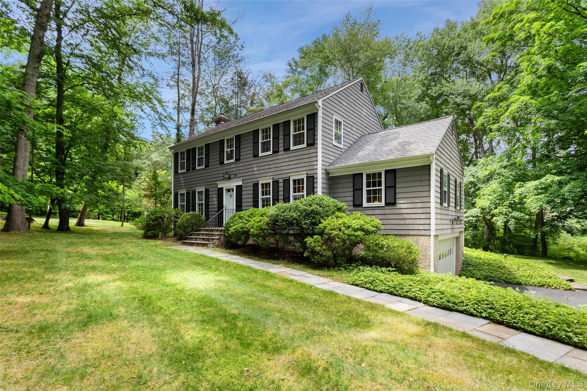 CLASSIC BEDFORD. Located at the end of a quiet cul-de-sac, peaceful acre with private backyard. Traditional Country Colonial meticulously maintained and brimming with potential. Nicely scaled rooms with hardwood floors. Sun-filled Living Room with fireplace. Formal Dining Room. Kitchen with white cabinets and marble counters with door to the rear deck. Paneled Family Room with beamed ceiling. Four Bedrooms with private Primary Suite with spacious walk-in closet space and private Bath. Central air and automatic generator. Conveniently located with easy access to Bedford Village shops, restaurants and theater. Moments to area schools and commuting arteries. A wonderful opportunity!