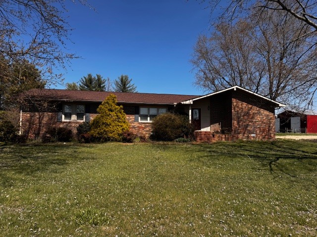 Lovely brick rancher nestled on 17+/- sprawling acres. This home offers the perfect blend of comfort, space, and functionality. Spacious living room with hrdw flooring, inviting kitchen, and a large master suite. Step outside to your private backyard oasis, complete with an in-ground pool ideal for relaxing or entertaining. For those in need of extra workspace or storage, this property  boasts a large detached garage and a versatile shop, perfect for hobbies, equipment, or other use. Whether you are looking for room to roam, a place to work on projects, or simply a peaceful retreat, this property delivers it all.  Selling AS IS