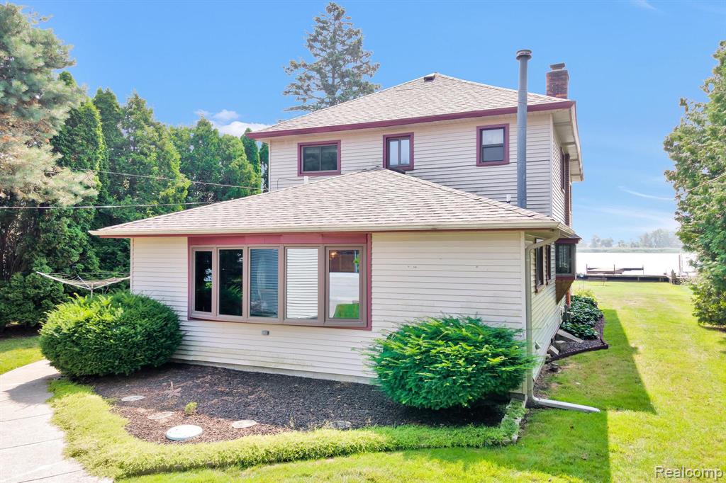 North Channel/Lake Saint Clair Waterfront, This Home offers 5 Bedrooms, 2 Full Bathrooms, a Detached 2.5 Car Garage with Electricity, Garage Door Opener and Side Door Entry.  Cement Driveway is wide enough for 6 to 7 Vehicles.  ***FEMA Letter of Map Amendment Determination Document, Flood Zone X, No Flood Insurance Required. Plenty of water views from the many windows in the Home and the Stamped Concrete Patio and Walkways.  Large Backyard with 61 Foot of Seawall.  Extensive Wooden Deck and Pier for Water Access.  The Open Floor Plan gives you Water Views from the Family Room, Kitchen, Dining room, Great room (with a Wood Burning Fireplace) and the Sitting/Sunroom.  Walking distance to the Board Walk, Harbour Club and the many other Venues Algonac has to offer.  Hunting, Fishing and Loving Every day in this Amazing Community.  Minutes from the Harsen Island Ferry and the Walpole Island Ferry.  Everyday is a Vacation in this Golf Cart Friendly Community. Algonac has Multiple boat Launches and Many Events along the Waterfront to include Outdoor Concerts.  Algonac has 5 Parks, almost 17 Acres of Open Recreation to include gazebos, splash parks, playgrounds and a New Built in Pool.  Existing Appliances Included: Refrigerator, Gas Oven Range, Dishwasher, Microwave, Washer and Dryer. New Roof October 2023.
