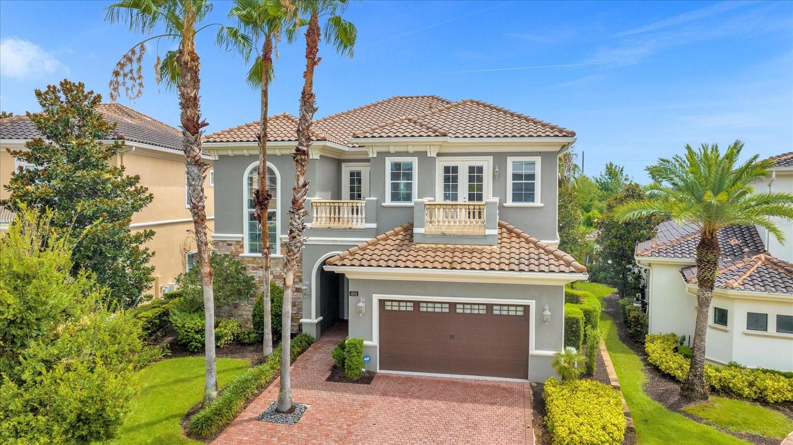 *Active Reunion Club Membership* Welcome to the renowned guard gated, golf community of Reunion Resort! Positioned on a tranquil conservation view lot, in the Legends Corner subdivision of Reunion Resort, sits this completely upgraded 6 bed 5.5 bath home, with the primary bedroom being on the main floor. Being sold fully furnished, with tasteful designer furniture, this home would make the perfect turnkey rental investment property, second home, or even a primary residence. As you enter the home you will be immediately greeted by the the open concept, light and bright living space. Extra high ceilings allow abundant light to enter the home, complete with custom touches such as tray ceilings, and crown molding throughout. This home has been upgraded to include something for everyone, a little ones dream playroom can be found on the first floor, featuring arcade games, a full size slide, and multiple play forts, creating a space where your little ones can escape, and have fun for hours. The garage has been completely converted into a theatre room, complete with luxury leather, reclining stage seating, a pro grade 4k projector, accent lighting, and a mini split A/C, making this room an extension of the main home. Commercial grade luxury laminate wood flooring has been added throughout the main level, and second level of the home. Centrally located in the home, the dining room includes a 10 seat extra large table, positioned perfectly under the mezzanine overlook from the second floor, allowing two story high views from the dinner table. Making your way to the kitchen, you will immediately notice the upgraded cabinets, granite countertops, and stainless steel appliances. The kitchen opens up to the living room also, complete with a bar top and seating area, making this kitchen functionally perfect for entertaining. Moving into the living room, you will be drawn into a state of relaxation, beautiful tray ceilings cover the majority of the living room. An electric functioning fireplace has also been added to the living room, making this space a warm and inviting place to hangout with family. As you exit the rear of the home through the extra tall, wall to wall sliding glass doors, you will enter yet another place where friends and family can gather to create memories. The extended back pool patio is complete with everything you will need to enjoy summer days and nights with your family. An outdoor summer kitchen, complete with table and chairs can be found under your covered patio. For outdoor entertaining, enjoy a large 21x30 pool with a built in Hottub, lounge chairs, fire pit with chairs, and many table games and activities for the family to enjoy. Upstairs you will find the remaining 5 bedrooms, a loft area complete with a pool table and separate sitting area. Three of the upstairs bedrooms also have access to their own balcony. Reunion Resort is a luxury resort, that also allows short term rental. Reunion Resort is a top choice for visitors of all ages, Featuring 12 Pools In The Community, Including a multimillion dollar water park, 3 championship golf courses, 5 restaurants, tennis/pickleball courts, putt putt golf, and many more amenities, making Reunion truly a city within gates. This home is turnkey, and has so much more to love, that you will have to see in person to appreciate. It is now your turn to call Reunion Resort your new home, or home away from home, welcome home.