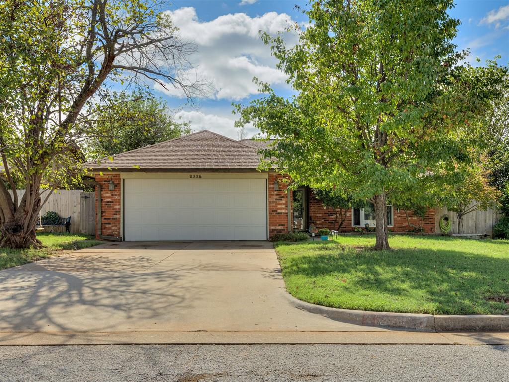 Fantastic 3-bed, 2-bath home in Edmond's Northwood addition! This 1,600 SF home features a spacious living room with a classic brick fireplace, gas logs, and built-in shelving. The functional kitchen includes dark cabinetry, stainless steel appliances, and an adjacent dining area. Enjoy wood-look flooring throughout, a private owner's suite, and great outdoor space featuring both covered and open decks. Complete with a 2-car attached garage, OKC utilities, and top-tier Edmond schools (Orvis Risner, Cimarron, Memorial HS). Great location near Eastern and Memorial—schedule your tour today!