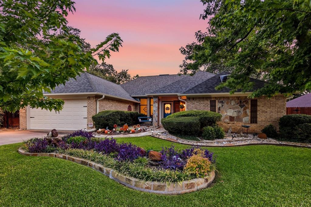 Meticulously maintained & thoughtfully updated, this inviting single-story home offers 3 bedrooms, 2 bathrooms, a fantastic floor plan, and an abundance of storage. From the moment you arrive, the care and attention given to this property are evident.Inside, the spacious living room features a wood-burning fireplace and dry bar with existing plumbing, offering the option to easily create a wet bar. The primary suite is generously sized and features a beautiful mural, updated bathroom, and multiple closets for exceptional storage. Two additional bedrooms are located on the opposite side of the home, providing privacy and flexibility.A versatile bonus room with a timeless copper tin ceiling offers endless possibilities for a home office, playroom, reading room, or creative space. The cozy den provides an additional spot to relax, while the breakfast room features a vaulted wood ceiling that adds warmth & character. The true showstopper is the expansive cedar covered screened back patio. Designed for both entertaining & relaxing, this incredible outdoor living space features two hanging swings, a TV, built-in bench with storage, and refrigerator. Beyond the patio, the backyard continues to impress with stone pathways & patio areas, lush St. Augustine grass, a custom-painted fence, and an adorable she-shed that could be used for extra storage, workshop, or peaceful retreat.Additional features include updated Pella windows with plantation shutters throughout, a roof approximately 4 years old, rain gutters with gutter guards, and thoughtful updates throughout the home. Most furniture is negotiable, excluding the primary bedroom furniture and front bedroom furniture, making it truly move-in ready.Conveniently located to DFW Airport, major highways, shopping, restaurants, & everyday amenities, this home offers both comfort and convenience. Warm, cozy, exceptionally cared for, and move-in ready! This is the kind of property buyers wait for.