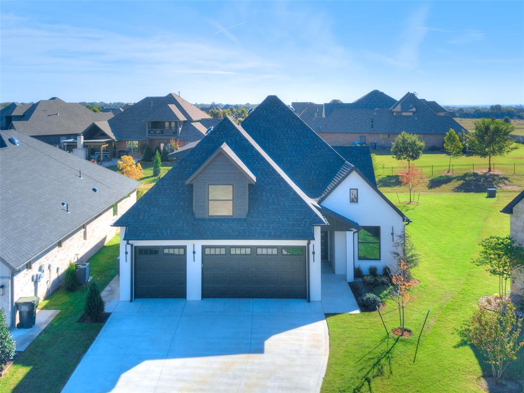 Discover the epitome of luxury living in this exquisite 2,822 sqft residence, boasting four generously sized bedrooms and three full bathrooms, complemented by a three-car garage. As you enter, be greeted by the vaulted entryway adorned with striking light fixtures and an eye-catching beam, setting the tone for the elegant details that unfold throughout this home. The vaulted living room, bathed in natural light, features a beautiful fireplace that serves as the heart of the home, inviting warmth and relaxation. The open floor plan seamlessly connects living spaces, including a gourmet kitchen equipped with a large island, chef-quality appliances, and premium hardware, perfect for culinary enthusiasts and entertaining alike. Adjacent to the kitchen, the dining area, illuminated by more natural light and a chic chandelier, offers an intimate setting for meals. Secluded at the back of the home for maximum privacy, the primary bedroom is a true sanctuary, complete with an en-suite bathroom that boasts a large shower, a free-standing tub, and double vanities, alongside a remarkable closet. The front bedroom, with access to a hall bathroom, provides a convenient option for guests. Venture upstairs to discover two additional spacious bedrooms, a landing space that doubles as an additional living area or playroom, and a shared bathroom with double sinks, catering to both comfort and functionality. The large laundry room, with space for an extra fridge, and an oversized pantry, underscore the thoughtful design of this home. Enjoy the convenience of HOA-managed lawn care and well-water sprinklers, alongside exclusive access to a resort-style pool, offering a distinguished lifestyle within a vibrant community. Welcome to a home where every detail has been curated for those who value sophistication and comfort. Houses are open Monday - Friday 2pm - 5pm