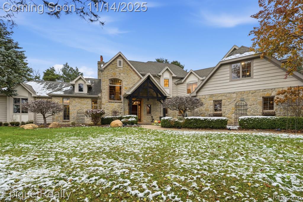 Welcome to Horse Country! Hidden near the end of a quiet country lane, this remarkable estate offers the kind of privacy, serenity, and architectural romance rarely found outside the French countryside. Set on 10 rolling, wooded acres with exclusive ownership of the picturesque pond just across the lane this property delivers a lifestyle that feels worlds away, yet remains just minutes from Metamora’s charming downtown village. Experience true French Country elegance at “Le Mas.” From the moment you step into the grand foyer, you’ll be captivated by the unmatched character and craftsmanship of this custom-built home. The estate features reclaimed French terra cotta tile from a barn in France, custom hand-sewn Canadian timber beams, and a breathtaking natural limestone fireplace that anchors the great room. The stately main-floor primary suite includes a gas fireplace, private deck, spa bath, and dual custom walk-in closets. A chef-ready kitchen impresses with glazed maple cabinetry and designer appliances, including double ovens and a warming drawer. This showstopper kitchen opens to the dining room, great room, deck, and enclosed screened porch perfect for entertaining. Main-floor laundry adds everyday convenience. Upstairs offers two spacious bedrooms and a full bath, while a second staircase leads to a massive bonus room with a full bath ideal as a 4th or 5th bedroom, studio, or private retreat. The sprawling walkout lower level provides an additional 2,500+ square feet, featuring a continuation of the striking limestone fireplace, and is plumbed for a future full bath. Additional highlights include a 4-car garage, Andersen casement windows, geothermal heating, Generac generator, central vac, steel gutters, and low-maintenance landscaping. A rare opportunity to own a secluded, architecturally significant estate that has been freshly updated. Only two owners since built. Located in Dryden Schools and close to M-24 and I-69. Home may be under surveillance. BATVAI.