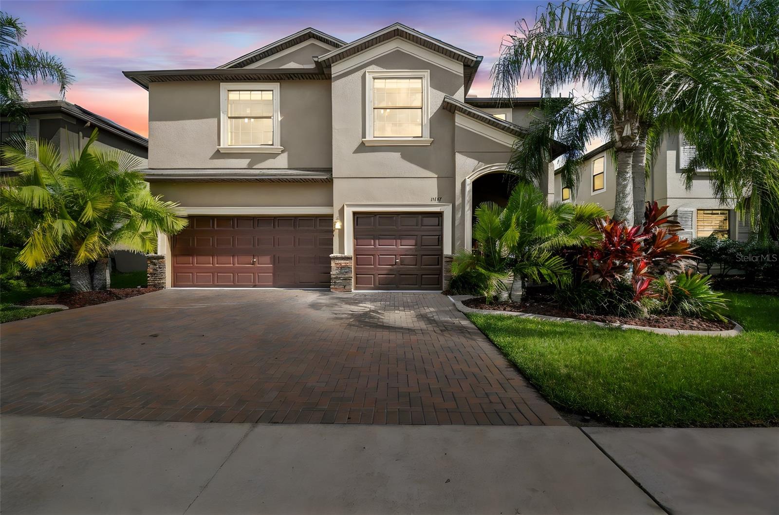 Enjoy nature and the views of local wildlife from your six-bedroom, four-bath family home as you take in sunrises across the pond within the gated community of Trinity Preserve. Built in 2014, this spacious home offers 3,938 total square feet and 3,231 heated square feet with an open floor plan designed for both entertaining and everyday comfort. The modern kitchen features a large island with generous bar seating, stainless steel appliances, and wood cabinetry, opening to a breakfast area overlooking the patio and fenced backyard or leading toward a more formal dining space ideal for gatherings and festivities.  A bedroom on the first floor provides flexibility for guests or serves perfectly as a home office with tranquil water views. Upstairs, the primary suite offers a private lounge area, ensuite bath, and walk-in closet, all oriented toward the serene pond. A loft area provides additional living space and connects two bedrooms with water views and two more overlooking the community.  Constructed with durable block construction, this home includes a large PVC-fenced backyard with ample room for a pool, two zoned air-conditioning units and heat-pump Water Heater for energy efficiency, a triple-car garage with a pavered driveway, RainBird sprinkler system, dedicated indoor laundry room, and a combination of tile, LVT, and carpet flooring throughout. Located in a No-Flood X-Zone, the home offers security and peace of mind for years to come.  Trinity Preserve is a unique community that blends natural beauty with modern convenience. Residents enjoy coded gate access, well-maintained common areas, and reasonable HOA fees, creating a safe, family-friendly environment surrounded by peaceful landscapes. The community's location provides outstanding accessibility to major routes, with State Road 54 offering quick east, west travel across Pasco County and direct access to the Suncoast Parkway just five minutes away, leading to Tampa and Tampa International Airport.  U.S. 19 is about 15 minutes west, providing routes south to Clearwater and Dunedin and some of the best beaches in the nation as well as north to New Port Richey.  Everyday needs and leisure activities are just minutes from home. Nearby, HCA Florida Trinity Hospital, a full-service 278-bed hospital, and AdventHealth Medical Group Multispecialty at Trinity, with outpatient and specialty care, are both just minutes from the community. Shopping and dining are also close and convenient, with Trinity Village Center and The Shoppes at Trinity Lakes, anchored by Publix, restaurants, and fitness facilities are only minutes from your doorstep.  Combining comfort, convenience, and natural tranquility, this beautiful Trinity Preserve residence offers the best of modern Florida living, where every day begins with a peaceful sunrise over the pond and ends surrounded by the serenity of nature.