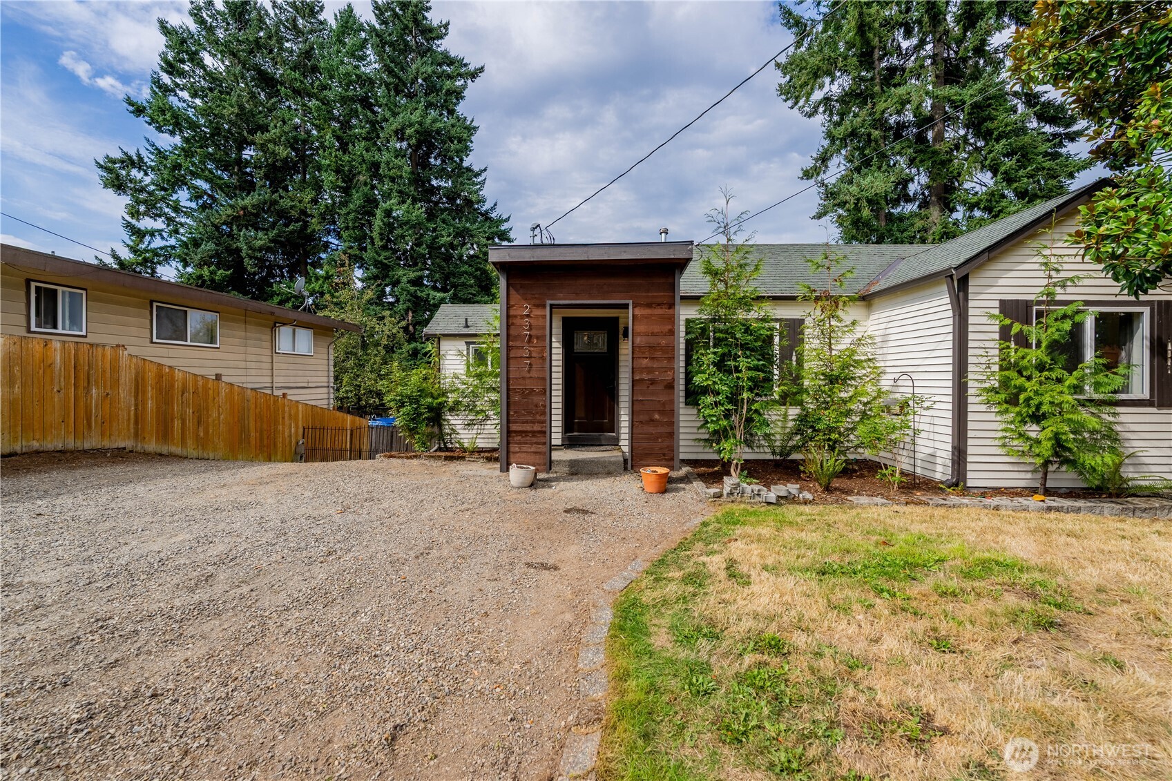 Charming and move-in ready! This 3 bedroom, 1.75 bath home blends comfort with modern touches. The updated kitchen offers newer cabinets, counters, and stainless appliances, while the main living area features LVP flooring and bright natural light. Step outside to a generous deck, accessible from both the living room and primary bedroom—ideal for relaxing or entertaining. The lower level expands your living space with a versatile second living room, full bath, and bedroom. A spacious patio, RV parking, and fenced yard make outdoor living easy. Located on Kent’s East Hill, close to schools, shopping, and transit!