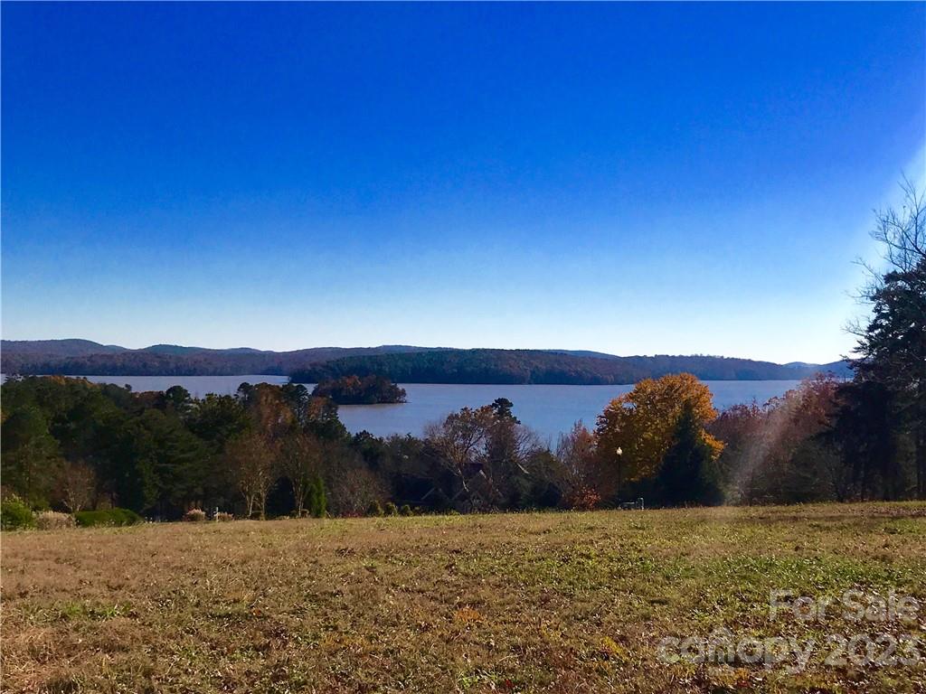 Beautiful lot overlooking the Uwharrie National Forest and Badin Lake. Elevated views of the Uwharrie National Forest and Badin Lake will be enjoyed from a custom built home of your dreams. Old North State Club continues to be one of the best golf courses in North Carolina. Old North State Club members enjoy many recreational amenities which include tennis courts, swimming pools, fitness center, lakefront guest lodge, marina, and full service clubhouse.