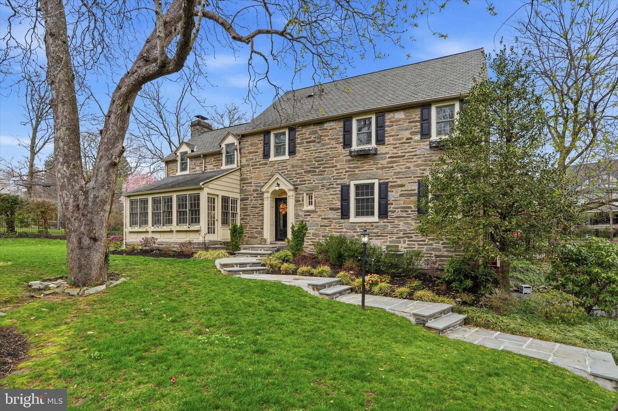 Be sure to watch the full motion video tour! Welcome to 401 Sabine Avenue—an exceptional Main Line residence that seamlessly blends classic charm, timeless elegance, and modern convenience. This beautifully maintained 5 bedroom and 3 full plus 2 half bath stone Colonial in the heart of Wynnewood offers 3,258 square feet of above-grade living space, plus a finished lower level adding about 500 additional square feet of living space.The location is truly unparalleled. From just outside your front door, a short stroll brings you to Suburban Square with its fabulous shops and eateries, Whole Foods, the Wynnewood or Ardmore SEPTA stations, and Lower Merion High School (although this location can go to either LMHS OR Harriton HS). In the other direction, enjoy easy sidewalk access to the vibrant downtown of Narberth, known for its charming boutiques, excellent dining, lively community events, and the beloved Narberth playground.A picturesque flagstone walkway leads to the welcoming foyer of this classic center hall Colonial, where gleaming hardwood floors, elegant millwork, two coat closets, and matching sets of French doors set the tone for the home’s timeless character.To the left, the formal living room features rich woodwork, a wood-burning fireplace, and access to a private rear deck, as well as a delightful three-season flagstone solarium filled with natural light. To the right, the formal dining room is perfectly proportioned for entertaining and showcases substantial built-in cabinetry for both display and storage, along with large windows accented by classic wood shutters.The updated kitchen is thoughtfully designed with newer cabinetry, granite countertops, a custom tile backsplash, built-in wine storage, stainless steel appliances, and a professional-grade range. In addition, this first floor boats a versatile and cozy den or home office with a wall of built-ins and direct access to the outdoor deck and yard. Completing this floor is a convenient powder room.Upstairs, the second floor offers a lovely primary suite and a large attached bathroom with a separate tub and shower configuration. Adjacent to the bath is an additional bedroom ideal for a nursery, home office, or guest space. Two more well-appointed bedrooms share a Jack-and-Jill bathroom, completing this level. The third floor provides a private fifth bedroom, a full bath, and a wall of closets offering excellent additional storage.The finished lower level expands the home’s living space and features an expansive recreation area with exposed stone walls, a powder room, and a full laundry room with built-in cabinetry. From here, enjoy direct access to the attached 1-2 car (depending on size) garage, complete with a brand new garage door and epoxy floor. Outside, the fully fenced yard offers privacy and mature landscaping, creating a safe and welcoming space for children, pets, or outdoor entertaining.Lastly, you won’t have anything to worry about after you move in as the current owners have taken care of so many expensive upgrades. To name a few, they have already removed all of the knob and tube wiring, quite recently installed a BRAND new top of the line, high efficiency heater in January of 2026, installed a new hot water heater in 2025, installed one new zone of central AC also in 2025 and the other in 2021, installed a new garage door in April 2026, replaced all windows with top quality Andersen Windows in 2021, and they replaced the entire sewer line out to the street and installed a new driveway – both in 2018!This classic Main Line home offers timeless architecture, generous living spaces, thoughtful upgrades and an unbeatable walk-to-everything location—truly an exceptional opportunity for its next owners.