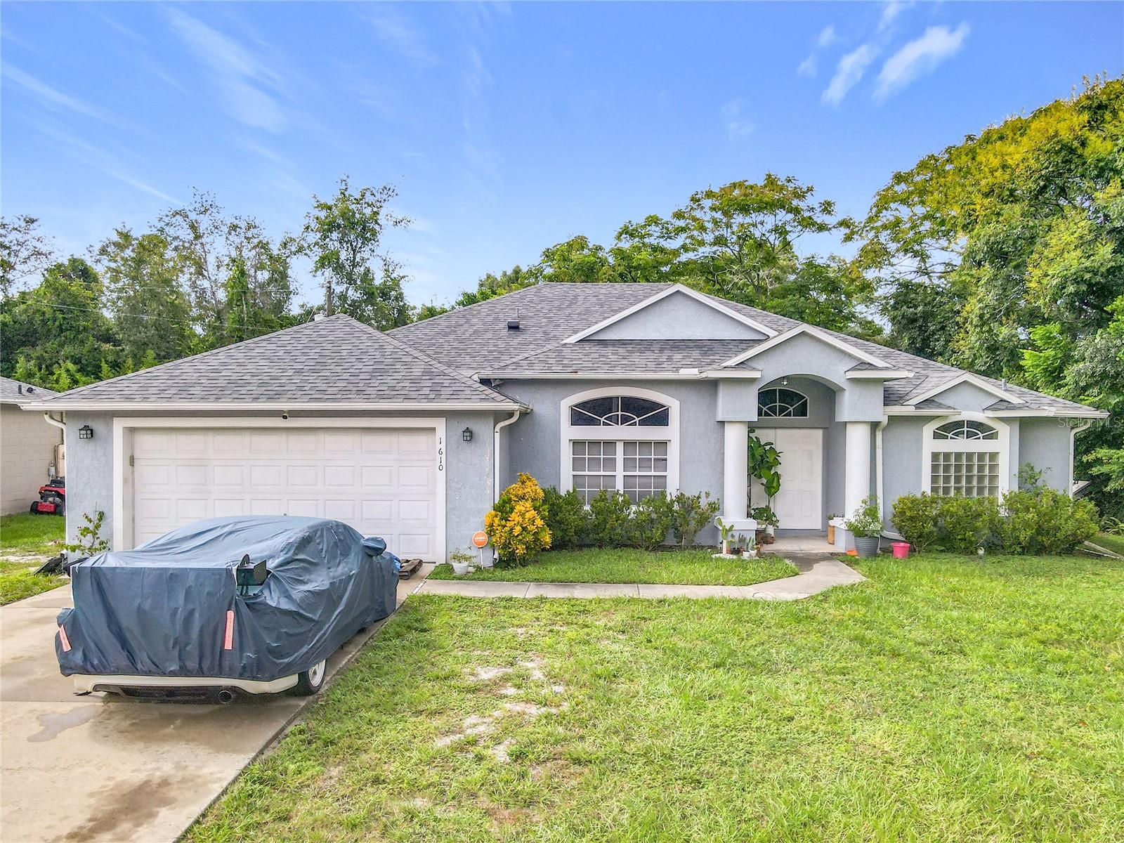Experience Florida living at its finest in this beautifully maintained 4 bedroom, 2 bath home featuring a screened in porch. Property has a  new water heater 2024, roof 2023, Newer HVAC system porcelain title through out the home. No HOA. Ideally situated in the heart of Deltona, the property offers convenient access to I-4 and is just minutes from shopping, dining, and entertainment. Golf enthusiasts will appreciate the proximity to the Deltona Golf Club, located just up the road. With a spacious floor plan and a private backyard oasis, this centrally located home is the perfect blend of comfort and convenience