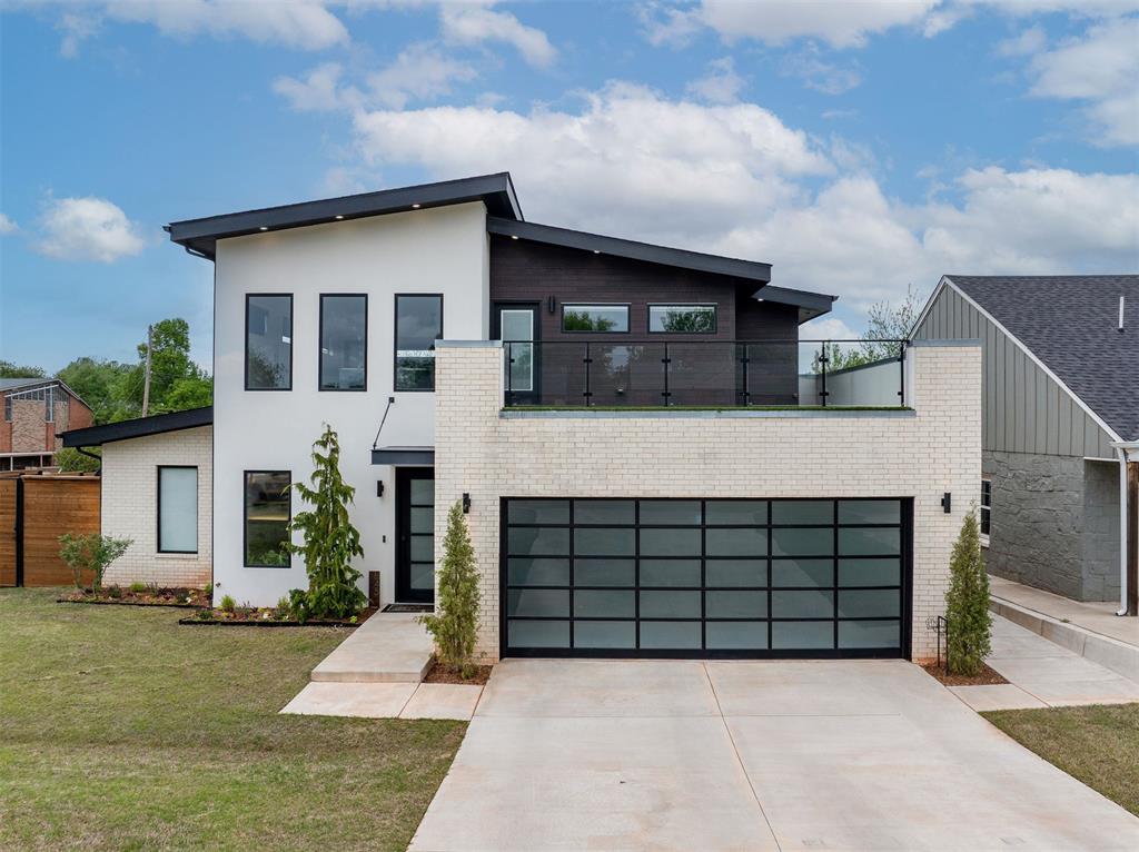 Experience elevated living in this stunning custom modern home, perfectly situated on a spacious corner lot. From the moment you step inside, you’re greeted by a breathtaking entry featuring a floating staircase w/ sleek glass railing. The open-concept layout seamlessly connects the dining, kitchen, & living areas, creating an ideal space for both everyday living and entertaining. Accordion-style glass doors in the dining & living areas fully open to the pool, creating a true indoor-outdoor living experience that’s perfect for hosting or relaxing. Just off the attached garage, a generously sized laundry room includes a convenient dog shower. The primary suite is thoughtfully located on the main floor, tucked away at the back of the home for ultimate privacy. Enjoy direct access to the pool through private doors, & unwind in the spa-inspired bathroom complete with dual walk-in showers, a standalone tub, & a large walk-in closet. Also on the main level, a versatile fourth bedroom or office sits adjacent to a full bathroom, which doubles as a pool bath w/ direct outdoor access. Upstairs, you’ll find a second living space open to the grand entry, featuring beautiful bamboo flooring, along w/ two additional bedrooms & a full bathroom. Multiple outdoor balconies extend from the upper level, overlooking both the pool & the front exterior—perfect spots to enjoy your morning coffee or unwind with a glass of wine. Step outside to your own private retreat featuring a resort-style pool with stunning water features, a Baja shelf for lounging, multiple seating areas, & a spa—perfect for relaxing year-round. The oversized corner lot is one of the largest in the neighborhood & includes a custom fence with ample space for kids or pets to play. Conveniently located near major highways, shopping, dining, & everyday essentials, this home offers both luxury and accessibility. At this price point, it won’t last long—schedule your private showing today!