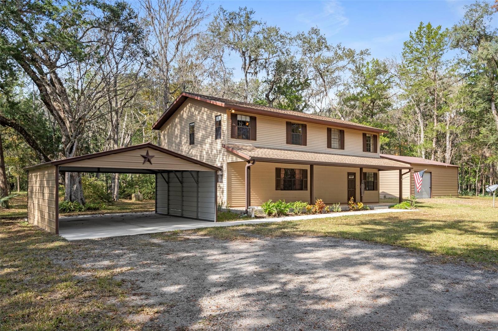 Escape the noise without sacrificing convenience on this rare 4.8-acre property tucked away in one of Brooksville’s most peaceful settings, just moments from the renowned Chinsegut Wildlife & Environmental Area. Surrounded by towering oaks, mature orange trees, and abundant wildlife, this is the kind of property that’s becoming increasingly difficult to find.The spacious 2,288-square-foot home offers 2 bedrooms, 2 full bathrooms, and an inviting layout designed for comfortable country living. At the heart of the home, a wood-burning fireplace creates the perfect gathering space, while oversized living areas provide plenty of room to relax, entertain, or customize to fit your lifestyle.Outside, the possibilities continue. A covered 2-car carport with a sidewalk leading to the home welcomes you in, while the impressive 30’ x 30’ metal building is ideal for a workshop, hobby space, equipment storage, or future projects. An additional storage shed provides even more flexibility.Whether you dream of gardening, raising animals, storing recreational vehicles, or simply enjoying the peace and privacy of nearly five acres, this Agriculturally Zoned (AG) property offers the freedom to make it your own. A drainage swale located at the front corner of the property helps direct water away, providing excellent natural drainage across the land.Spend your mornings sipping coffee while watching deer wander through the trees, harvest fresh oranges from your own yard, and enjoy the serenity that only acreage can provide—all while remaining within easy reach of Brooksville, shopping, dining, and the Suncoast Parkway.If you’ve been waiting for a property that offers serenity, usable acreage, a spacious home, and the outbuildings to support your hobbies or business, this is one you won’t want to miss.