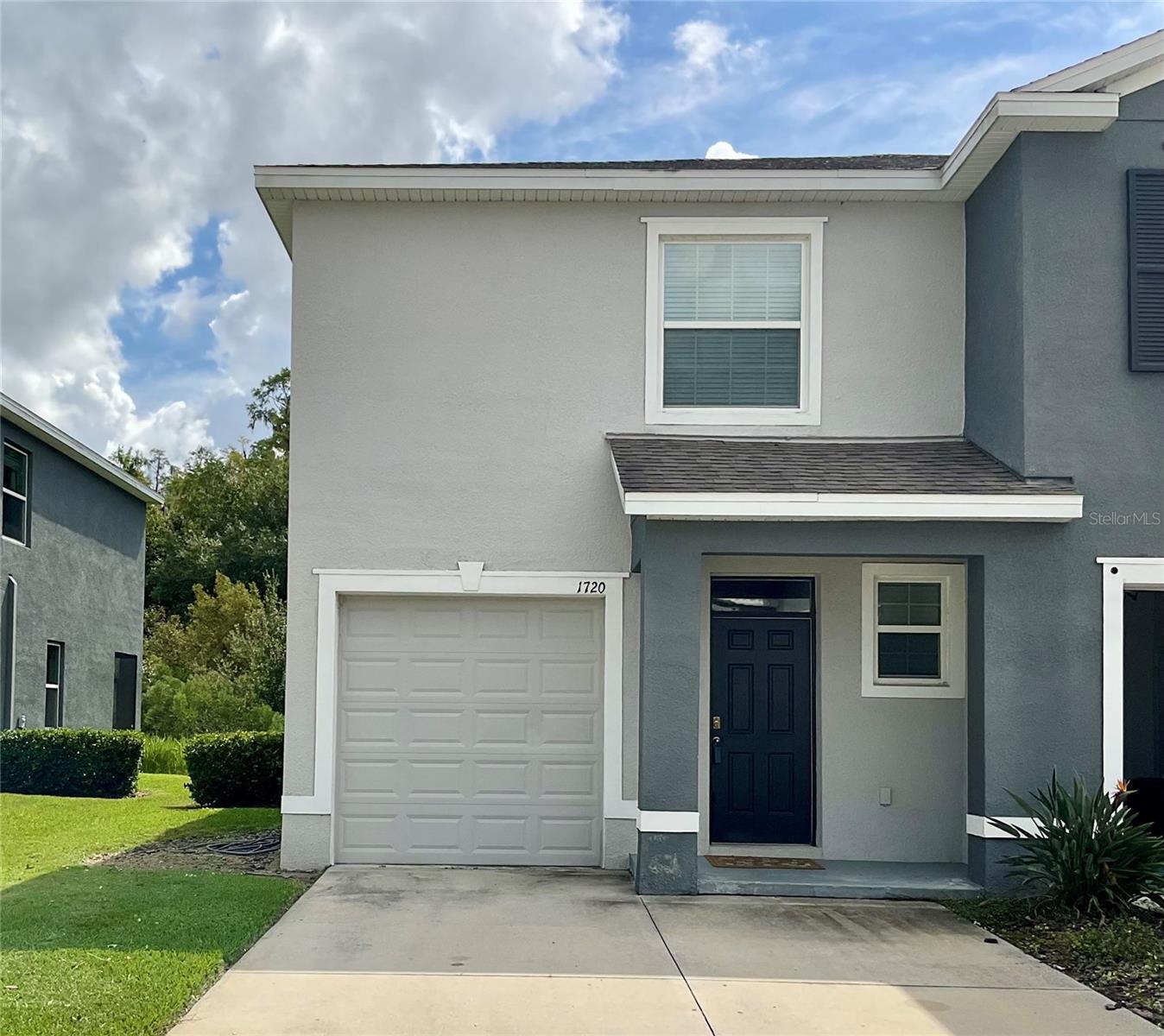 This welcoming end unit townhome is just waiting for someone to stop in and stay a while. The downstairs features a spacious kitchen with ample storage, opening onto a large family room. Sliding doors lead to a covered lanai perfect for enjoying cool autumn evenings with the grill. A half bath and 1 car garage complete the downstairs for convenience and practicality. Upstairs contains a generous primary bedroom with an ensuite bathroom and two walk-in closets, 2 additional bedrooms sharing a Jack-and-Jill bathroom, and an upstairs laundry closet saves the knees on laundry day and makes that task almost enjoyable. The Union Park neighborhood features a clubhouse, playground, and pool, and the monthly HOA fees include cable TV, internet, and access to all the recreational facilities. Union Park is conveniently located near schools, Wiregrass Mall, Tampa Premium Outlets, I-75, and medical facilities. Check it out and decide to stay a while.