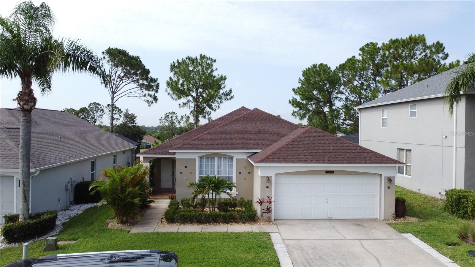 Stunning Golf course home in the prestigious golf community of Southern Dunes. *2018 ROOF * 2022 AC * WHOLE HOUSE WATER FILTRATION SYSTEM* PANORMAIC POOL SCREEN WITH GOLF COURSE VIEW*. This home shows real pride of ownership. Solid surface counters, luxurious new carpet and custom cabinetry in the dining area make you feel like you want to relax and stay a while. The refinished pool deck is south facing and features a panoramic pool screen to really take in the beautiful view. The lanai has a beautiful covered area for relaxing and enjoying the view of the course. The layout of this home is wonderful with two master suite's (Primary bath has pool access) and 2 additional bedrooms, making this perfect as a vacation rental investment winter home or permanent residence. Both bathrooms have had elegant upgrades including vanities with granite counters. The home is offered with some furniture and has a relaxing and elegant feel to it in one of the areas premier golf communities. Located in the highly acclaimed, 24-hour guard-gated Southern Dunes Golf & Country Club, the community also offers TENNIS COURTS, a CLUBHOUSE, PLAYGROUND and more. Shops, restaurants, and daily conveniences are just minutes away, with easy access to both Orlando and Tampa, the Gulf and Atlantic beaches, and major airports. Fairway homes of this standard are rarely available so come and see it for yourself today, You'll be glad you did!