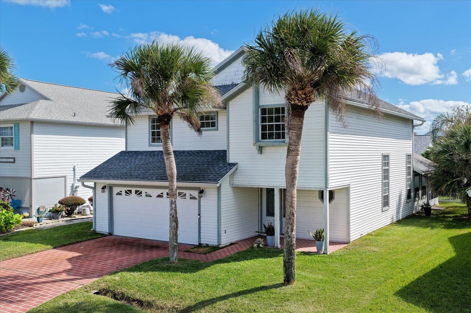 Great opportunity to make the lowest-priced home in Sea Colony your own! Located at 3 Avalon Terrace, this 3-bedroom, 2.5-bath home offers 1,842 square feet of living space and incredible potential to create your ideal coastal retreat in the gated oceanfront community of Sea Colony in Palm Coast, Florida. Featuring vaulted ceilings, abundant natural light, and a versatile floor plan, this home is ready for your personal touches and updates. The spacious living areas provide a welcoming atmosphere, while the kitchen offers generous cabinetry and counter space with plenty of potential to customize. An open loft adds flexibility for a home office, additional lounge area, or guest space. The primary suite features a walk-in closet and private bathroom, while the additional bedrooms provide comfortable accommodations for family and guests. Step outside to the large screened patio overlooking the backyard, offering a wonderful space to relax and enjoy Florida's coastal breezes. A two-car garage provides additional storage and convenience. Beyond the home, Sea Colony offers an exceptional coastal lifestyle with amenities including the oceanfront Sea Colony Beach Club, a spacious swimming pool, spa, clubhouse, and private beach access via a scenic boardwalk. Residents can also enjoy shuffleboard courts, a basketball area, and beautifully maintained tropical surroundings. Whether you're looking for a full-time residence, seasonal getaway, or an opportunity to renovate and personalize a home near the beach, 3 Avalon Terrace offers outstanding potential in one of Palm Coast's charming oceanfront communities. Bring your vision and make this coastal home your own!
