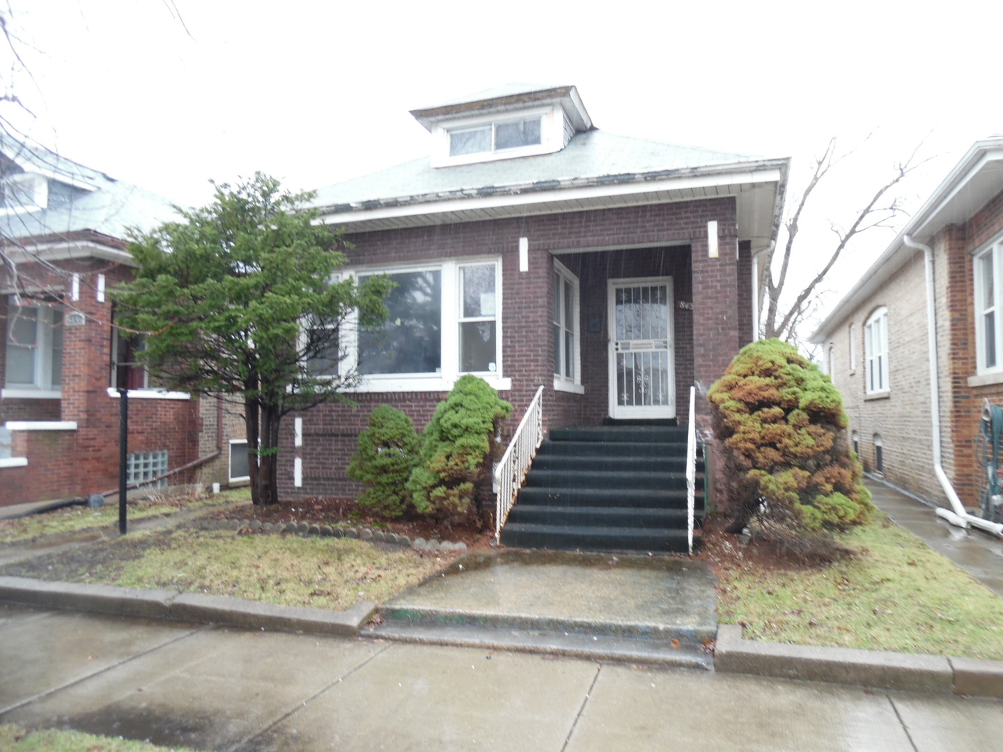 ***GREAT PRICE*** with some work this would be a nice home.. Brick Bungalow with unfinished basement & detached 2 car garage...Fenced backyard with some nice green space....Main floor has spacious living & dining room.. Kitchen, with plenty of cabinet space... 2 bedrooms & one full bath...Enclosed rear room that can be used for storage, mud room, what every you wish.. Hardwood floors, original trim & doors, fireplace... 2nd floor attic has 2 nice large bedrooms with 3/4 bath........Basement has ingress/egress to backyard... This space can be made into additional living quarters... Don't pass this up at this price point.......This home qualifies for FHA $100 Down Sales Incentive Program.....